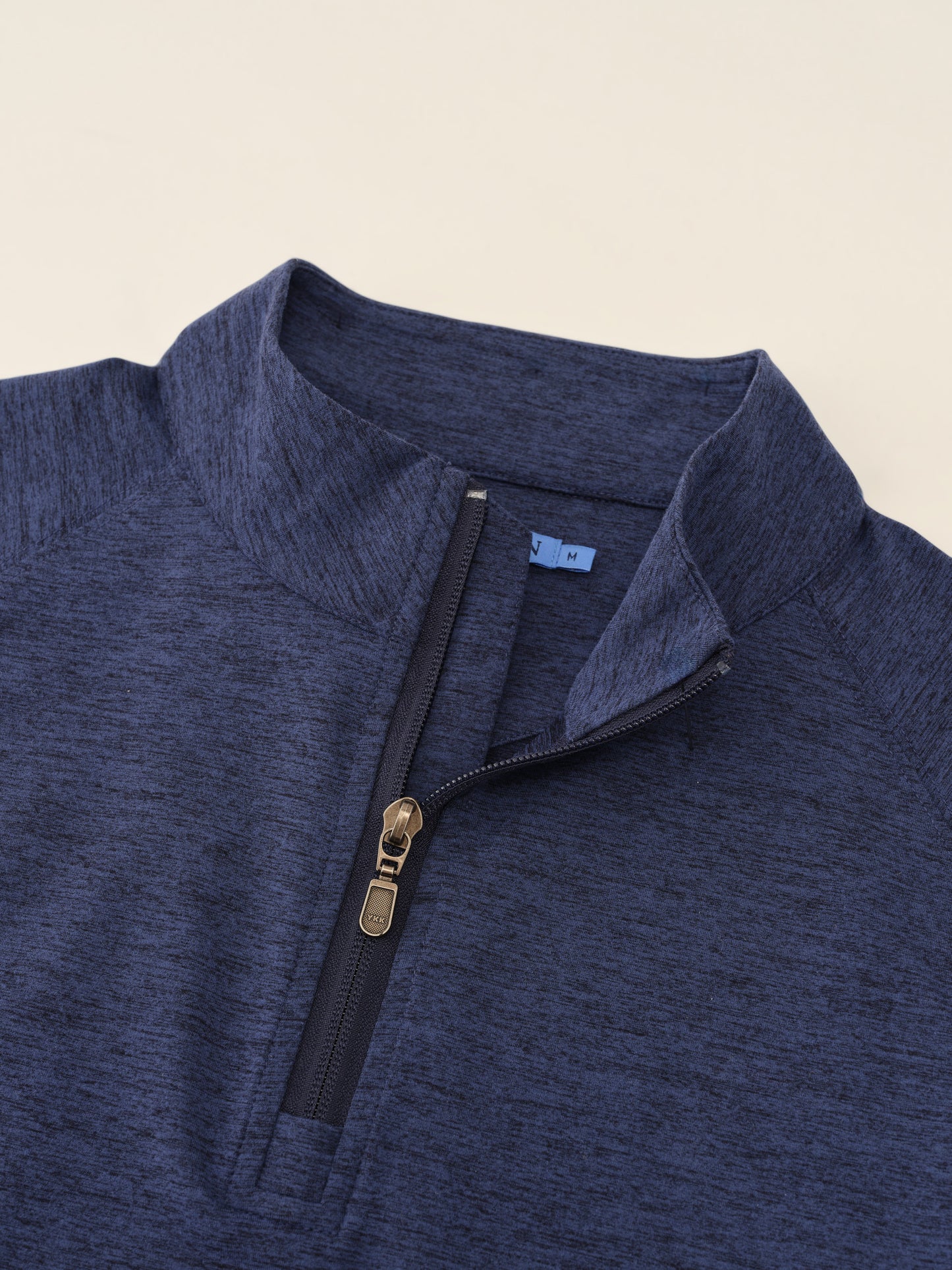 J.McLaughlin Featherweight polo in Heather Navy made with Polyester.