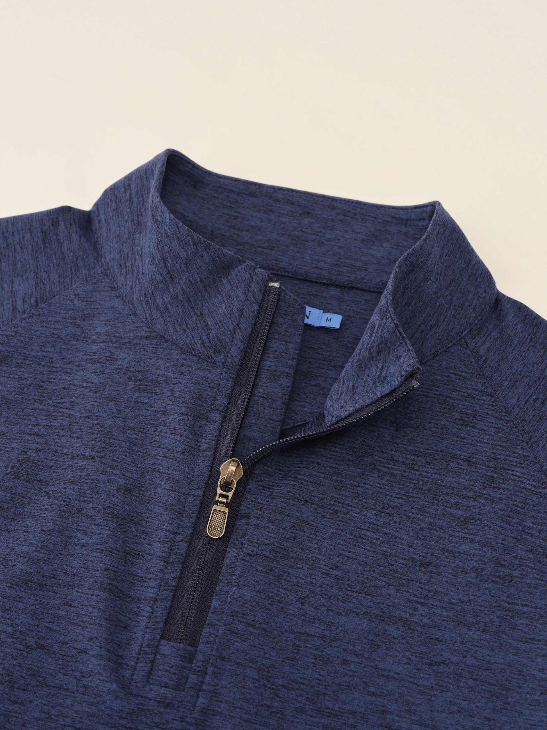 J.McLaughlin Featherweight polo in Heather Navy made with Polyester.