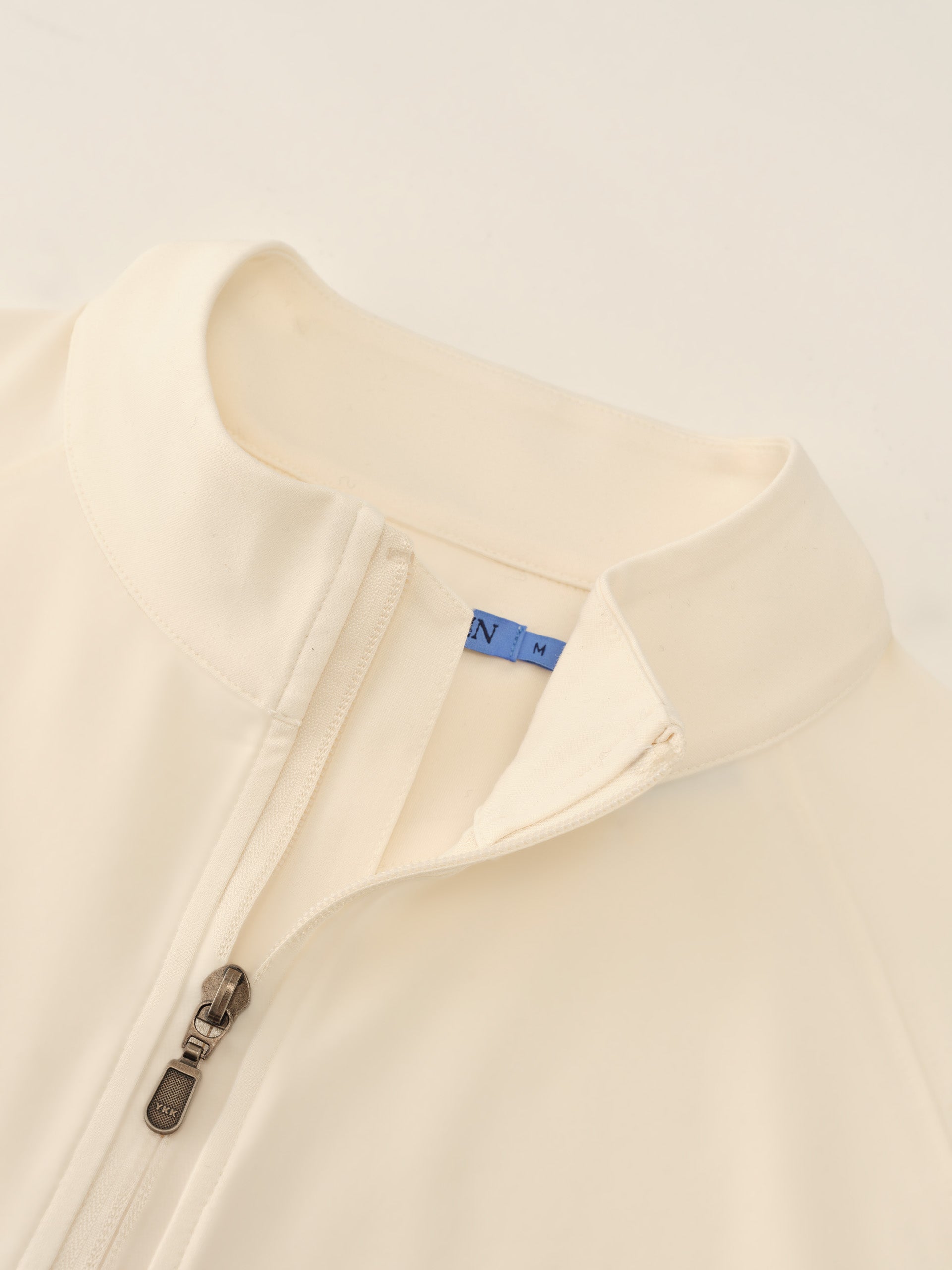 J.McLaughlin Featherweight polo in Off White made with Polyester.