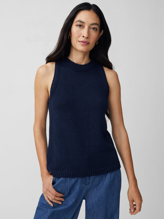 J.McLaughlin model wears Felicity Sleeveless Sweater in navy made with cotton/linen.