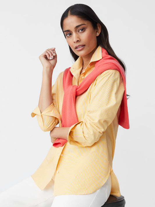 Model wears J.McLaughlin Finn shirt in golden/white made with cotton.