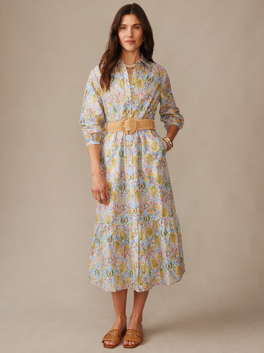 Woman wearing a Foley Linen Blend Dress in Tropico Tapestry by J.McLaughlin, featuring a floral pattern, belted waist, and styled with sandals for an effortlessly stylish look.