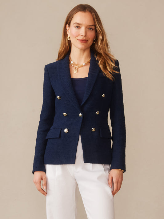 A woman models the Genevieve Cotton Bouclé Blazer by J.McLaughlin in navy, featuring double-breasted silver buttons and tailored design, reflecting effortlessly stylish, enduring designs with innovative fabrics from a destination for defining style. Life, Well-Lived.