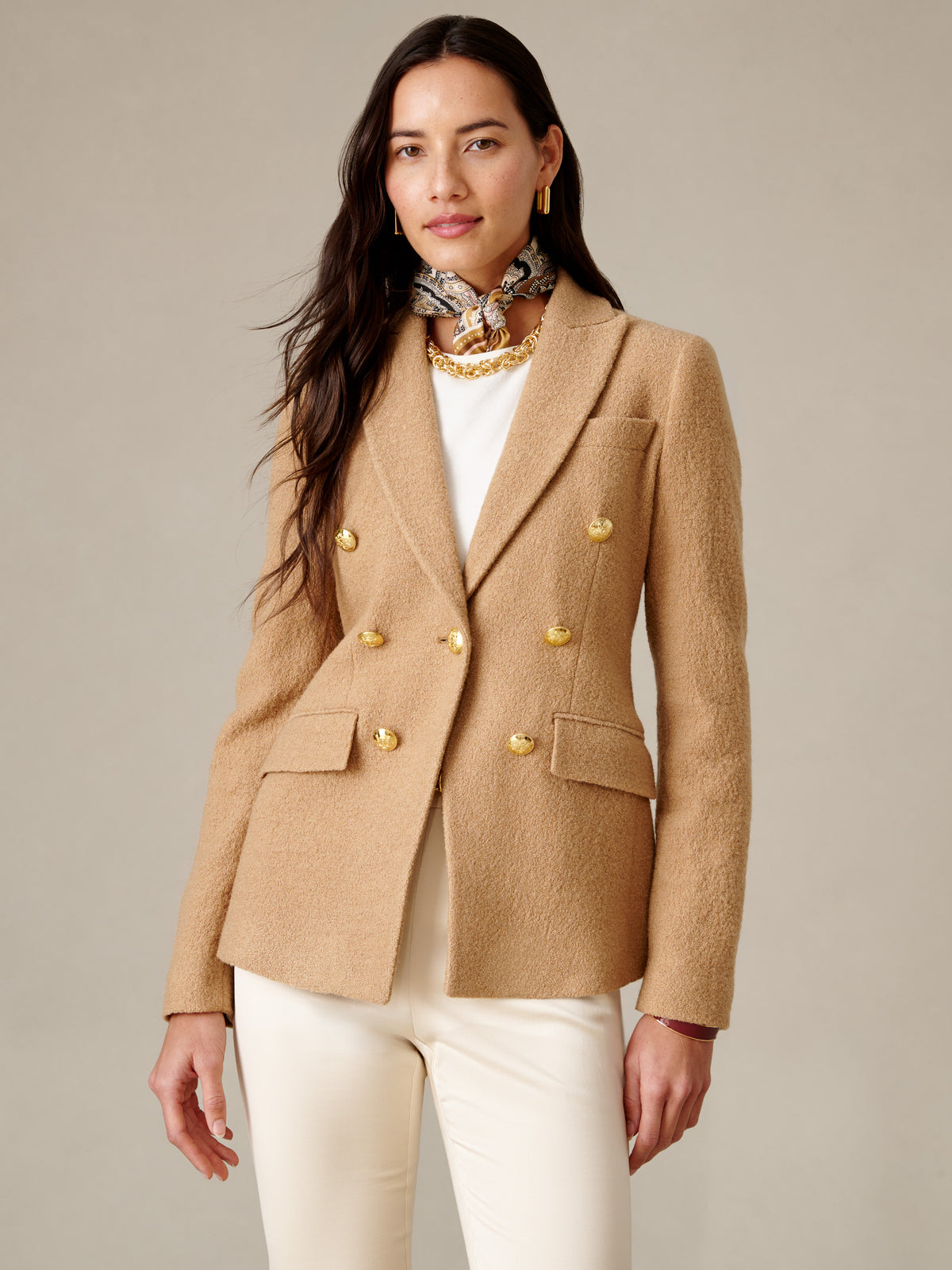 J.McLaughlin Genevieve Wool Bouclé Blazer in camel bouclé wool with double breasted tailoring worn with cream trousers and a printed scarf