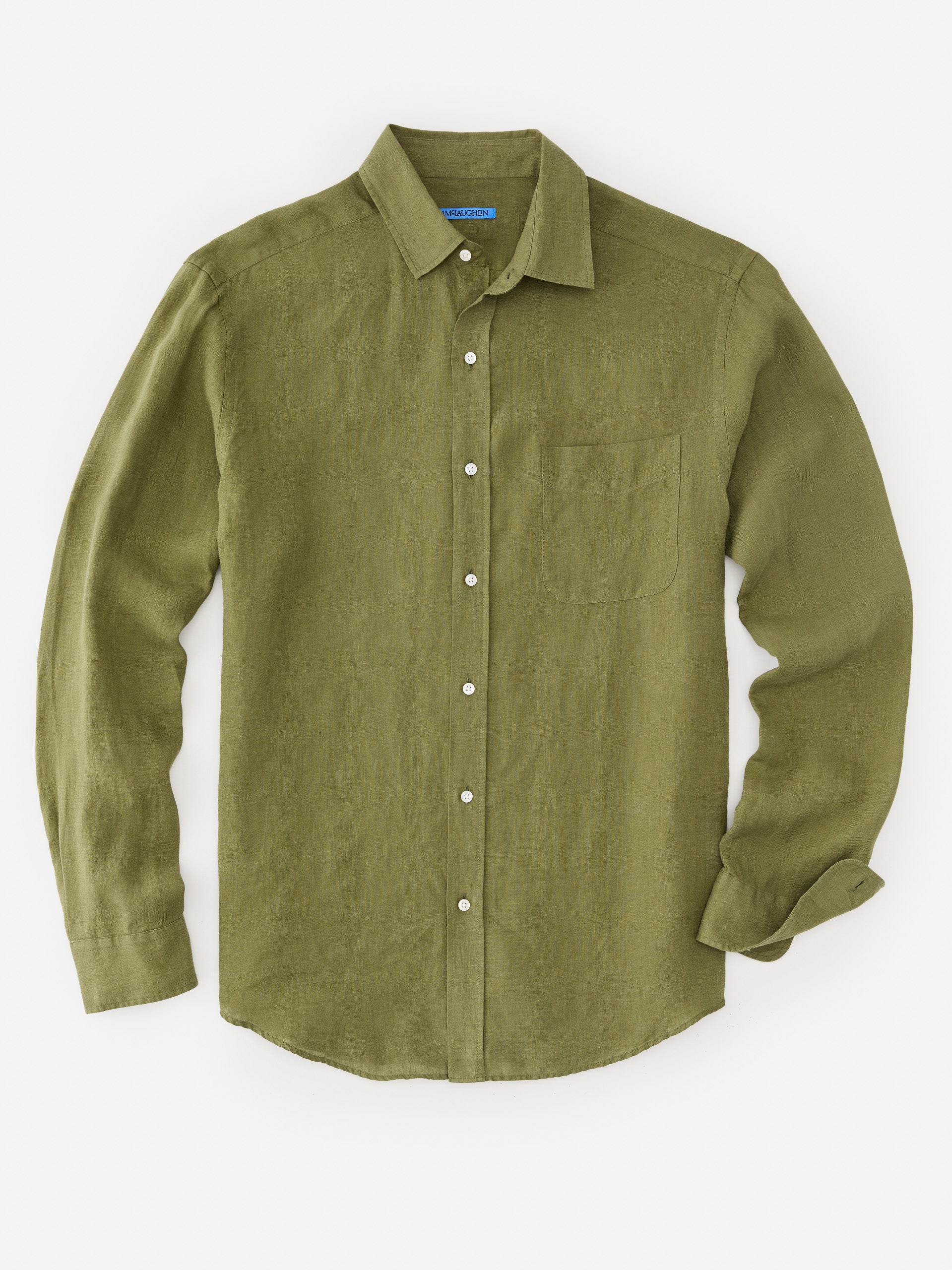 Model wearing J.McLaughlin Gramercy shirt in olive green made with linen.