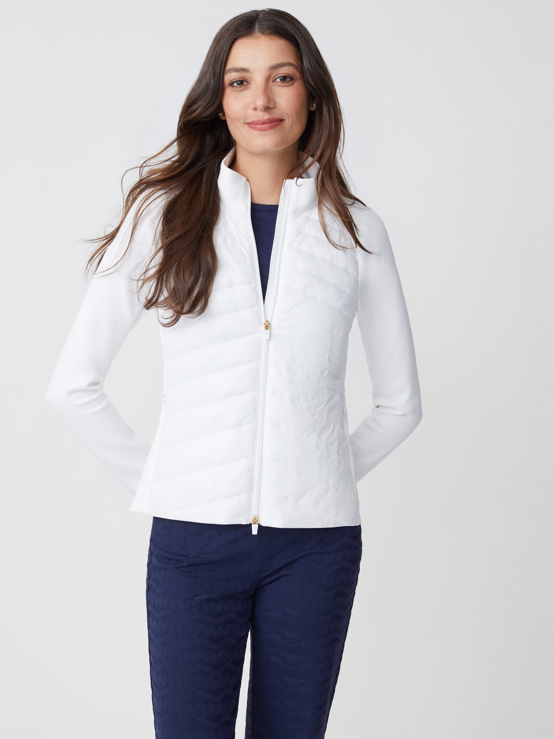 Model wears J.McLaughlin Grayer Jacket in white made with nylon.