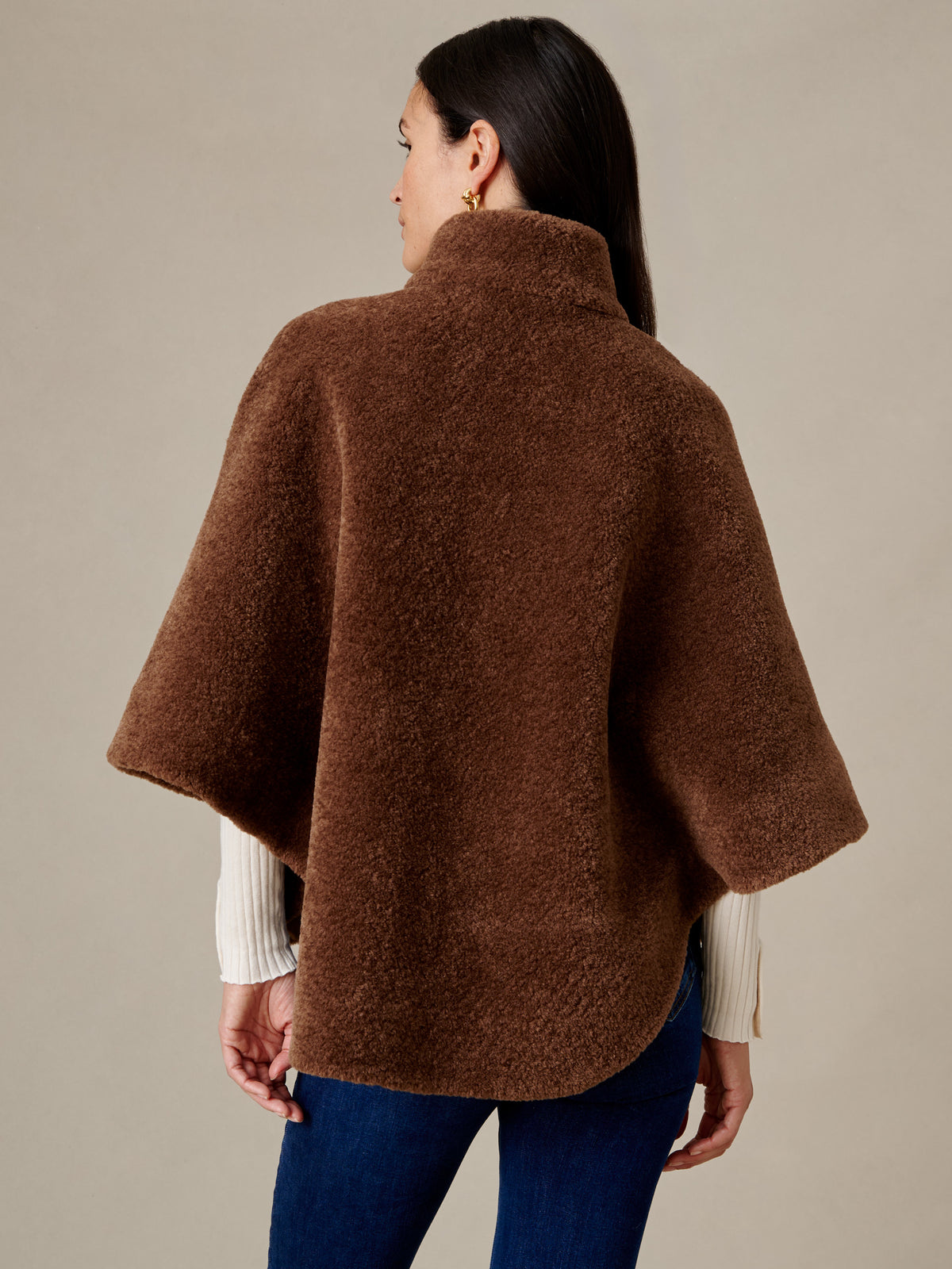 Gretchen Faux Fur Cape by J.McLaughlin shown from the back in rich brown plush faux fur with a cozy high collar and wide sleeves