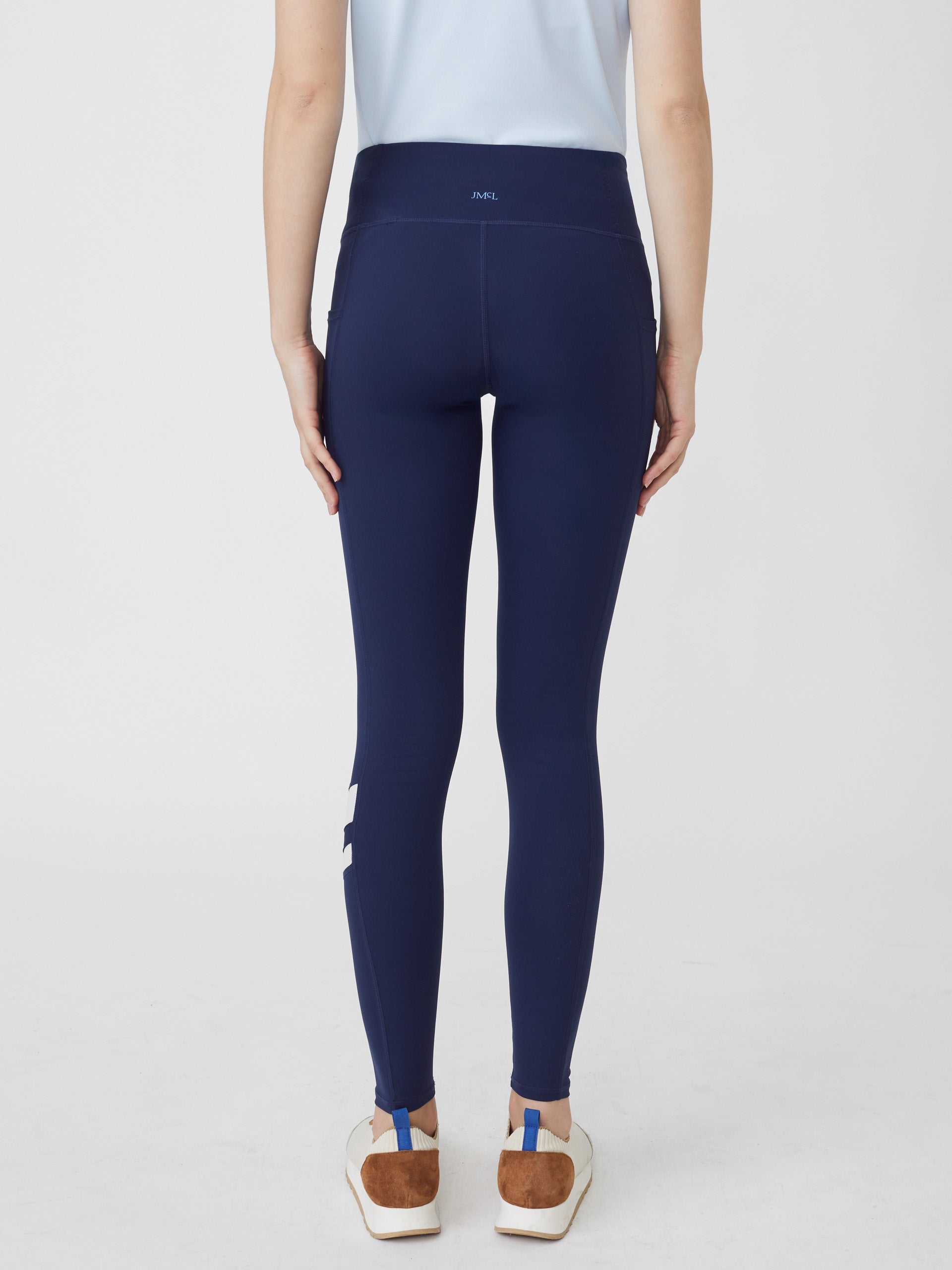 J.McLaughlin model wears Rae Leggings in Navy made with Nylon and Spandex.