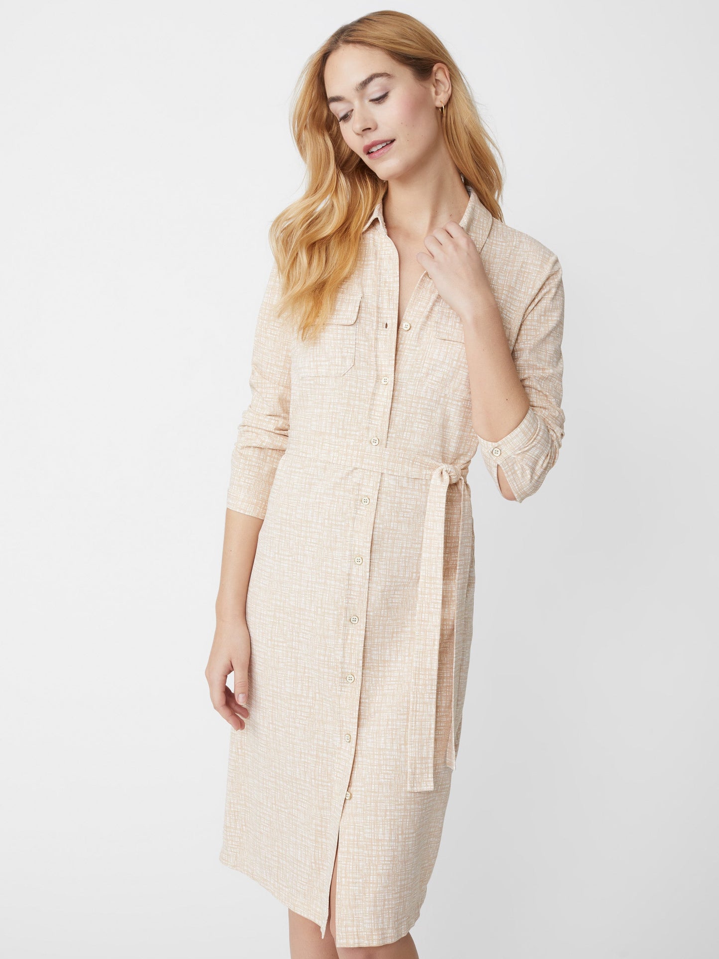 Model wearing J.McLaughlin Haarlem dress in off white/tan made with Catalina cloth.