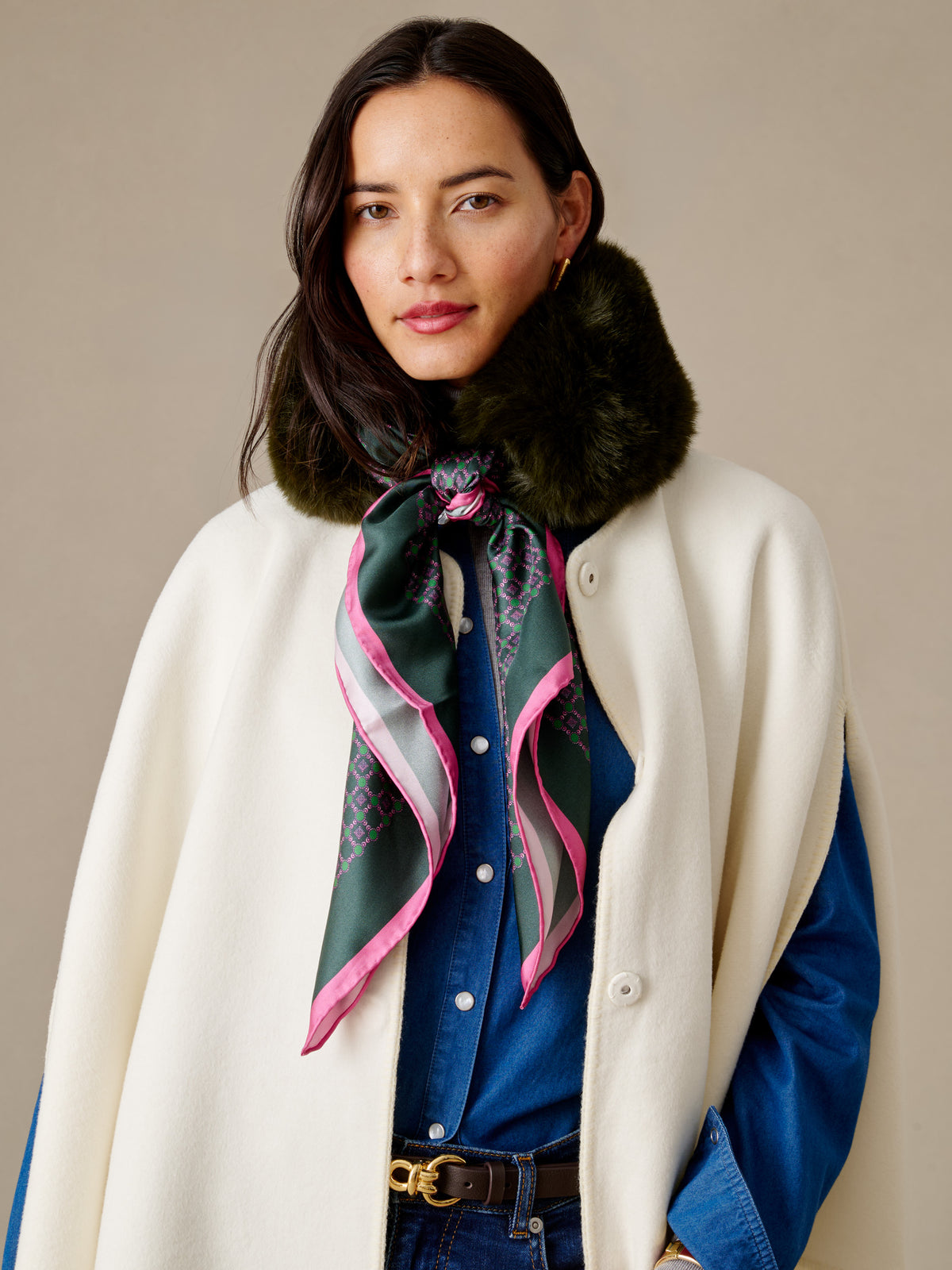 J.McLaughlin Camille Faux Fur Neckwarmer in Regent Chainlink Square styled with a silk print scarf and plush dark faux fur trim on a model