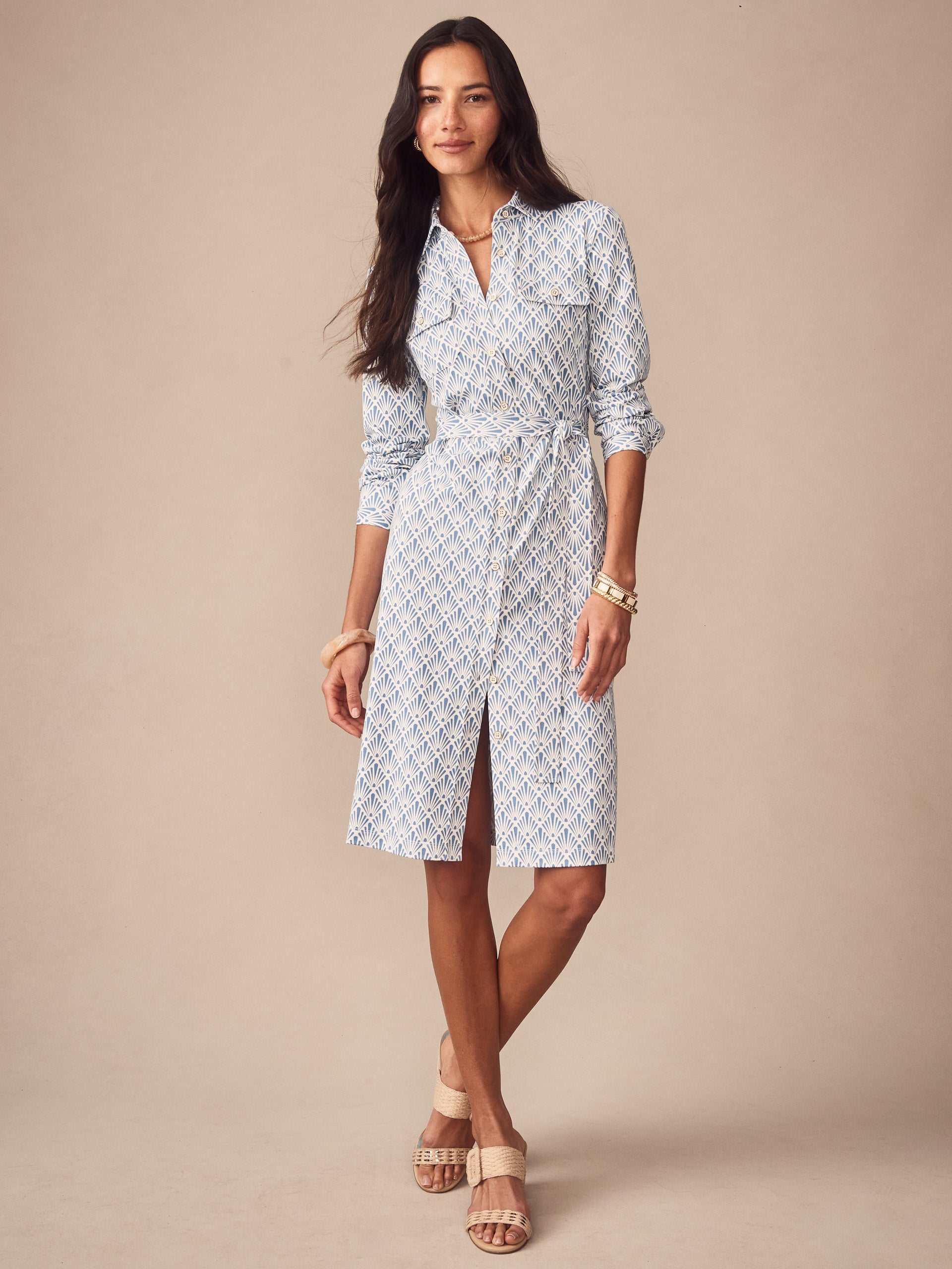 A model wears the Haarlem Dress in Sandshell by J.McLaughlin, showcasing effortlessly stylish, enduring designs crafted from innovative fabrics for a legacy of timeless fashion. A destination for defining style. Life, Well-Lived.
