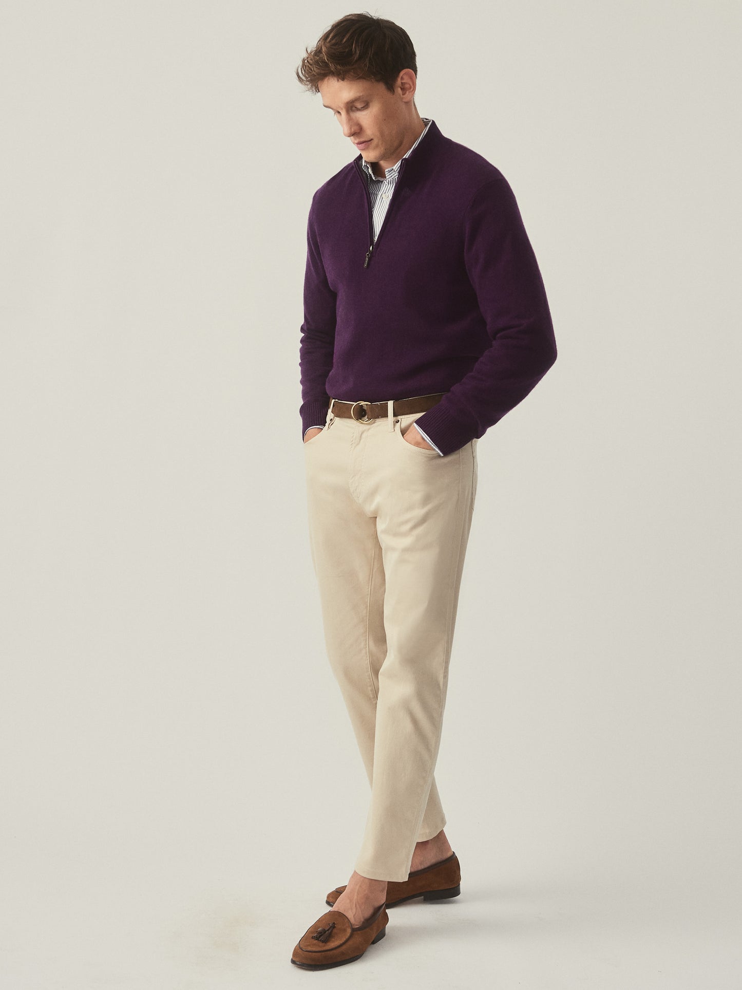 Model wearing J.McLaughlin Henry sweater in amethyst made with cashmere.