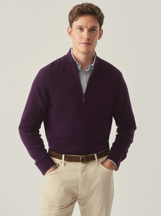 Model wearing J.McLaughlin Henry sweater in amethyst made with cashmere.