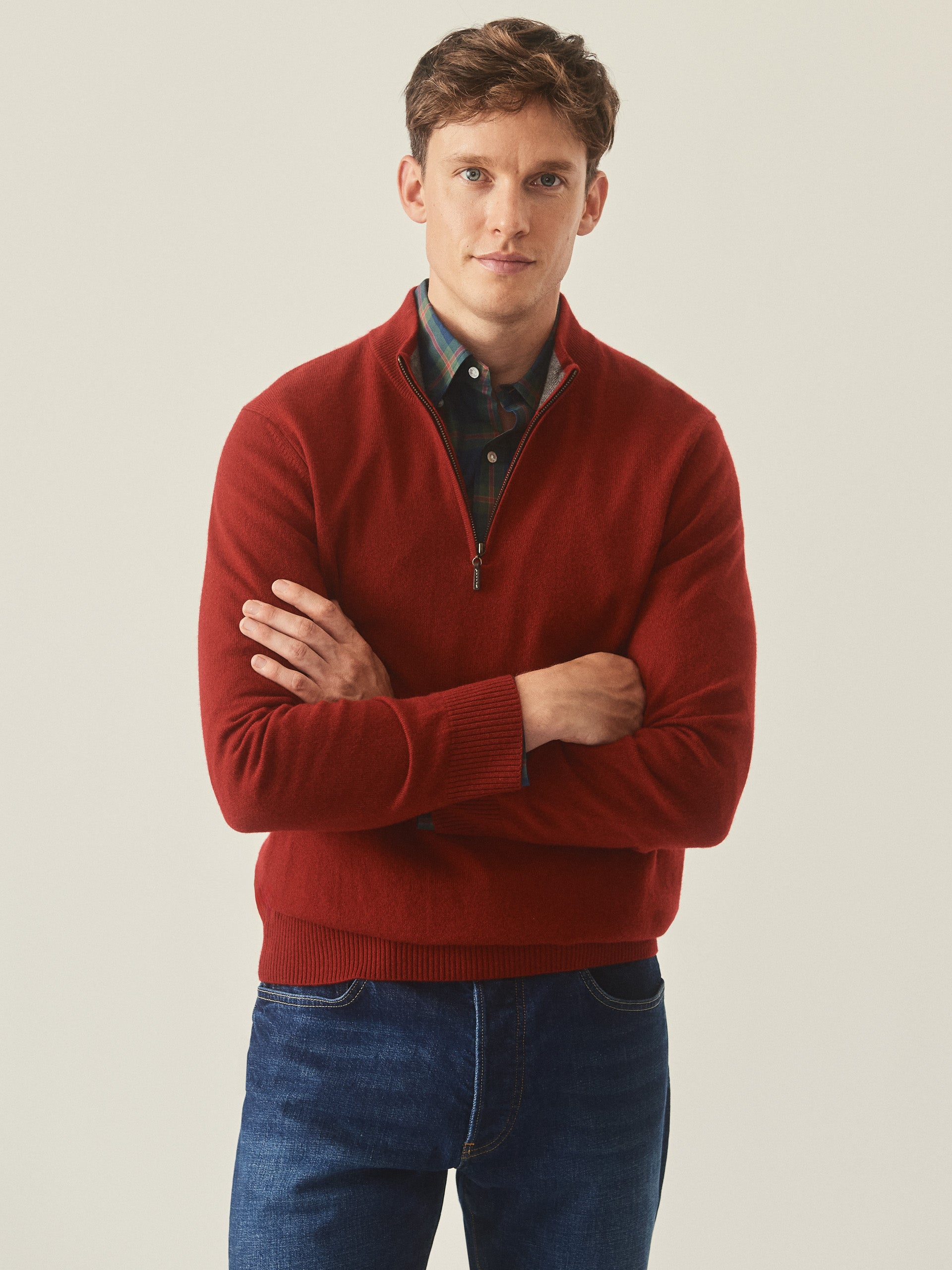 Model wearing J.McLaughlin Henry 1/4 zip in auburn made with cashmere.