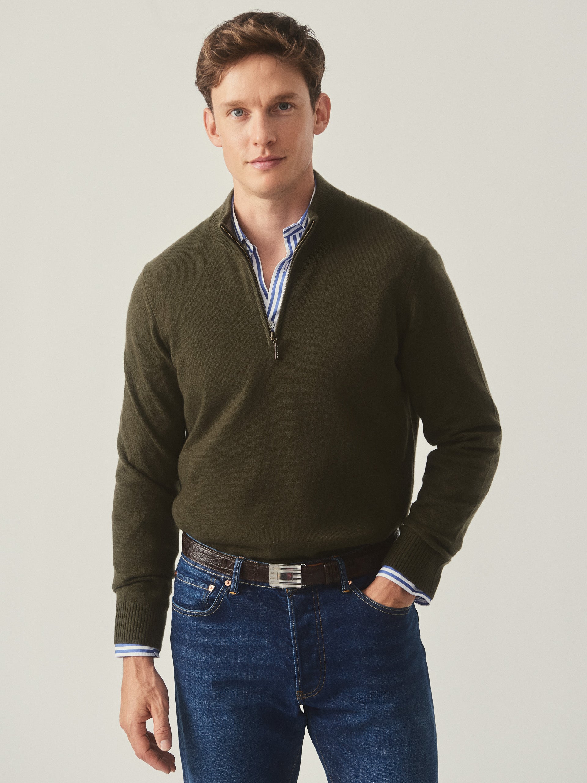 Model wearing J.McLaughlin Henry sweater in olive made with cashmere.