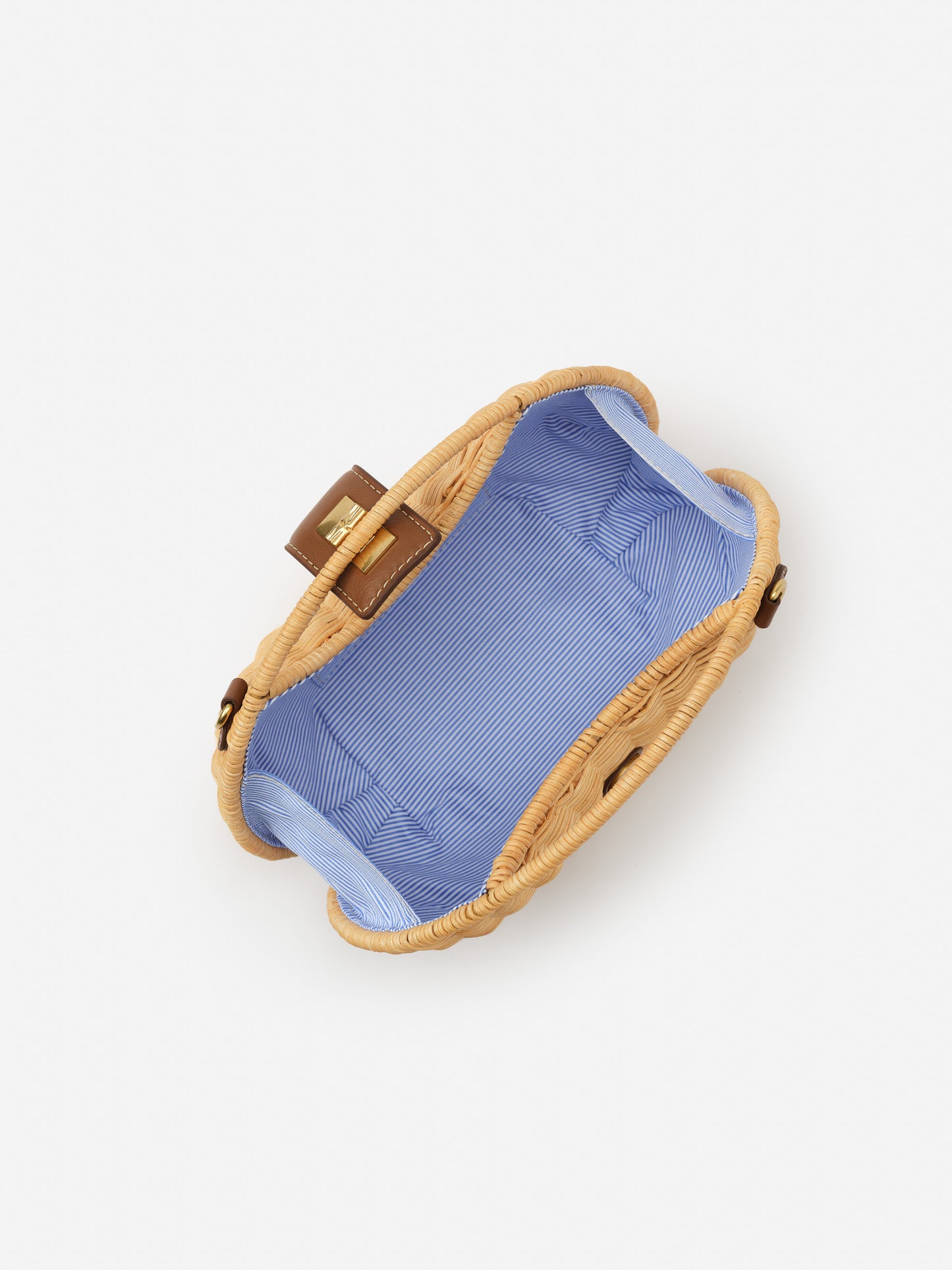 Open Iris Wicker Handbag by J.McLaughlin showing a blue and white striped fabric interior, combining effortlessly stylish design with enduring quality and timeless craftsmanship.