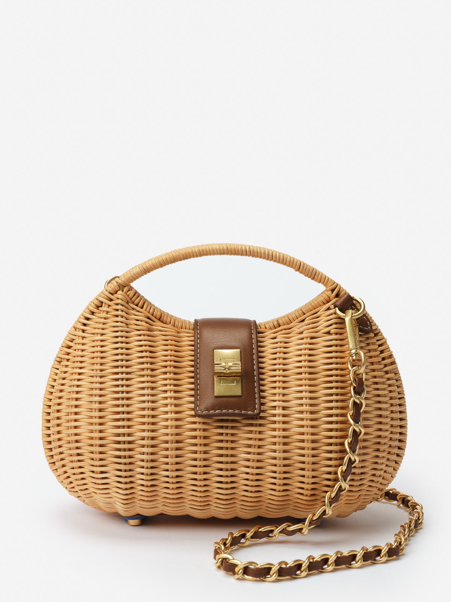 Iris Wicker Handbag by J.McLaughlin features a woven wicker body with a brown leather clasp and gold-tone chain strap, combining effortlessly stylish design with enduring craftsmanship.