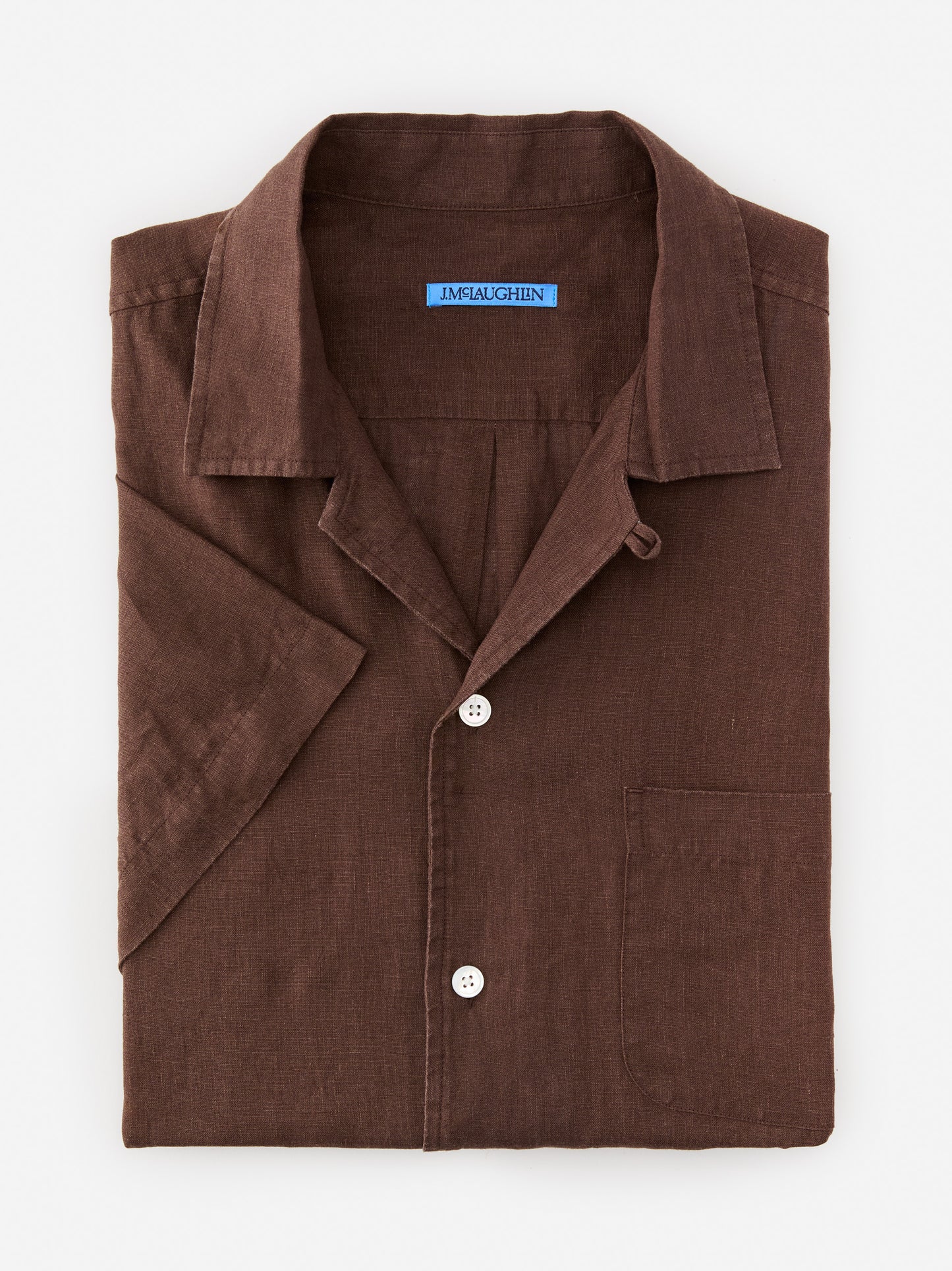 Model wearing J.McLaughlin Irons shirt in brown made with linen.
