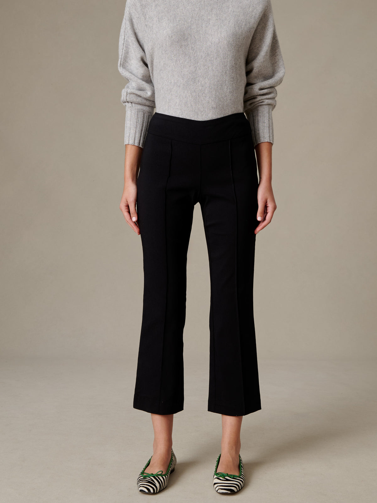 J.McLaughlin Ivy Pants in black with a clean pull-on waist and subtle flare leg styled with a gray sweater and striped flats