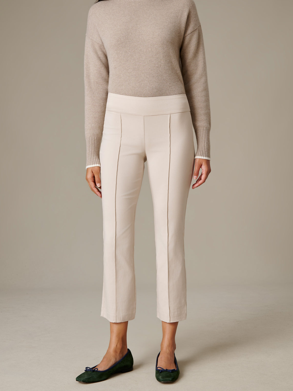 J.McLaughlin Ivy Pants in ivory with a clean pull on waist and subtle flare leg styled with a neutral sweater and green flats