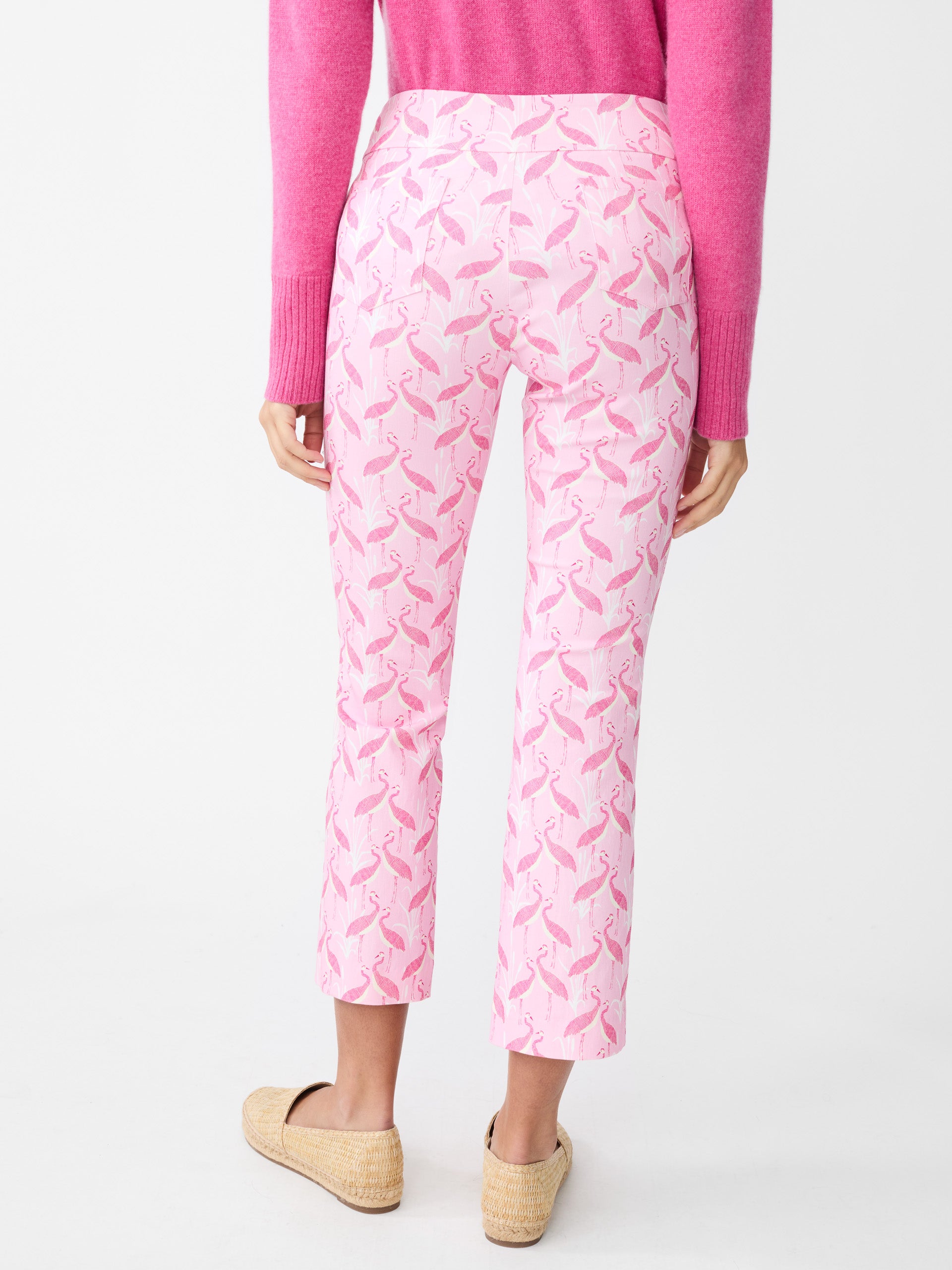 Model wearing J.McLaughlin Ivy pants in pink/light pink made with Amelia cloth.