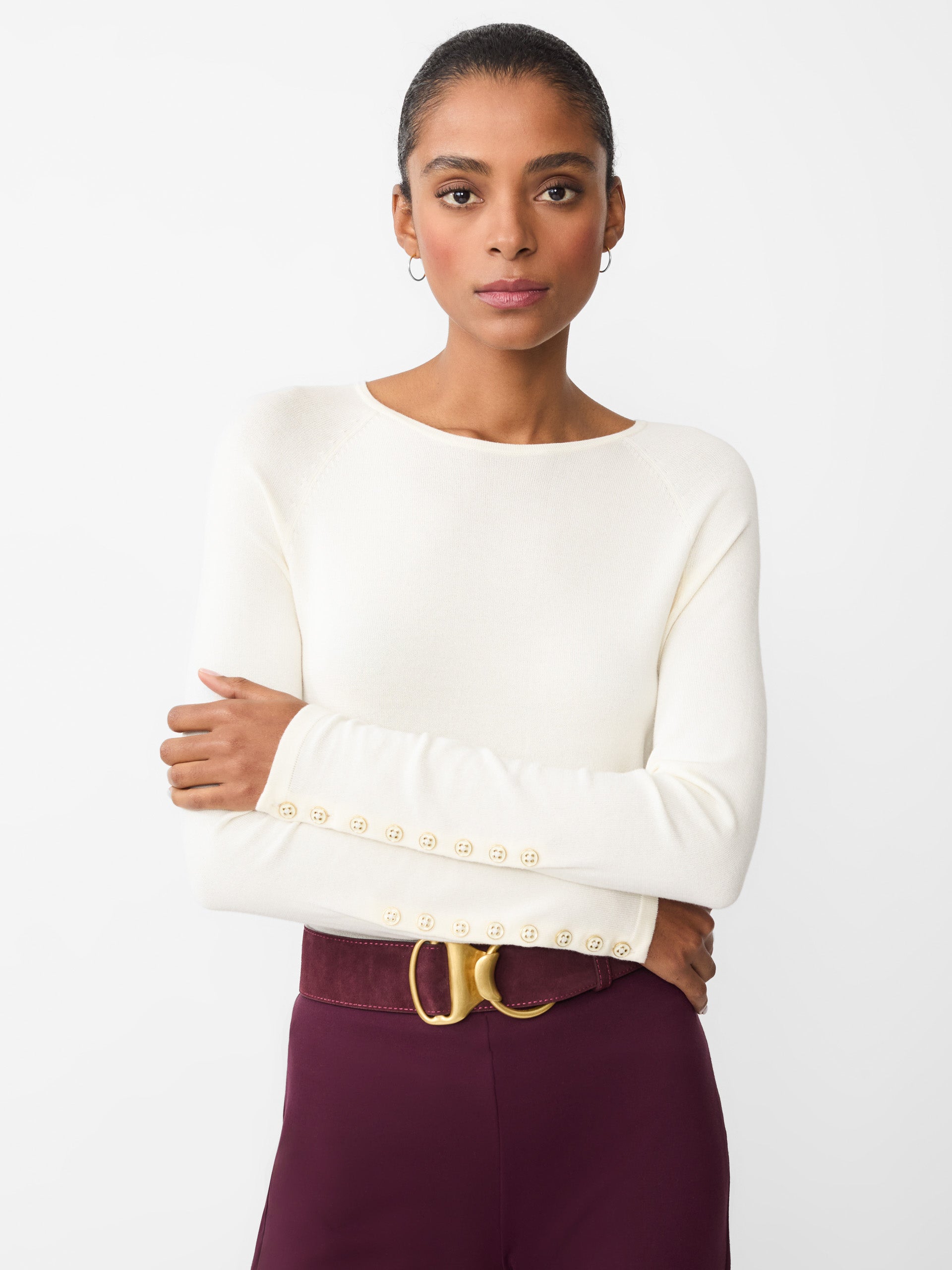 Model wearing J.McLaughlin Jamey sweater in egret white made with cotton/modal.