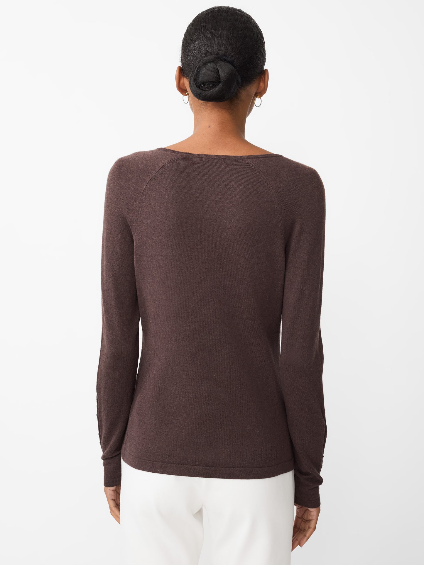 Model wearing J.McLaughlin Jamey sweater in heather brown made with cotton/modal.