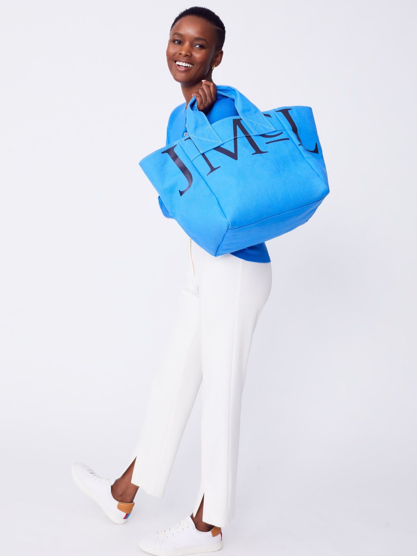 J.McLaughlin Logo tote in JMC blue made with cotton canvas.