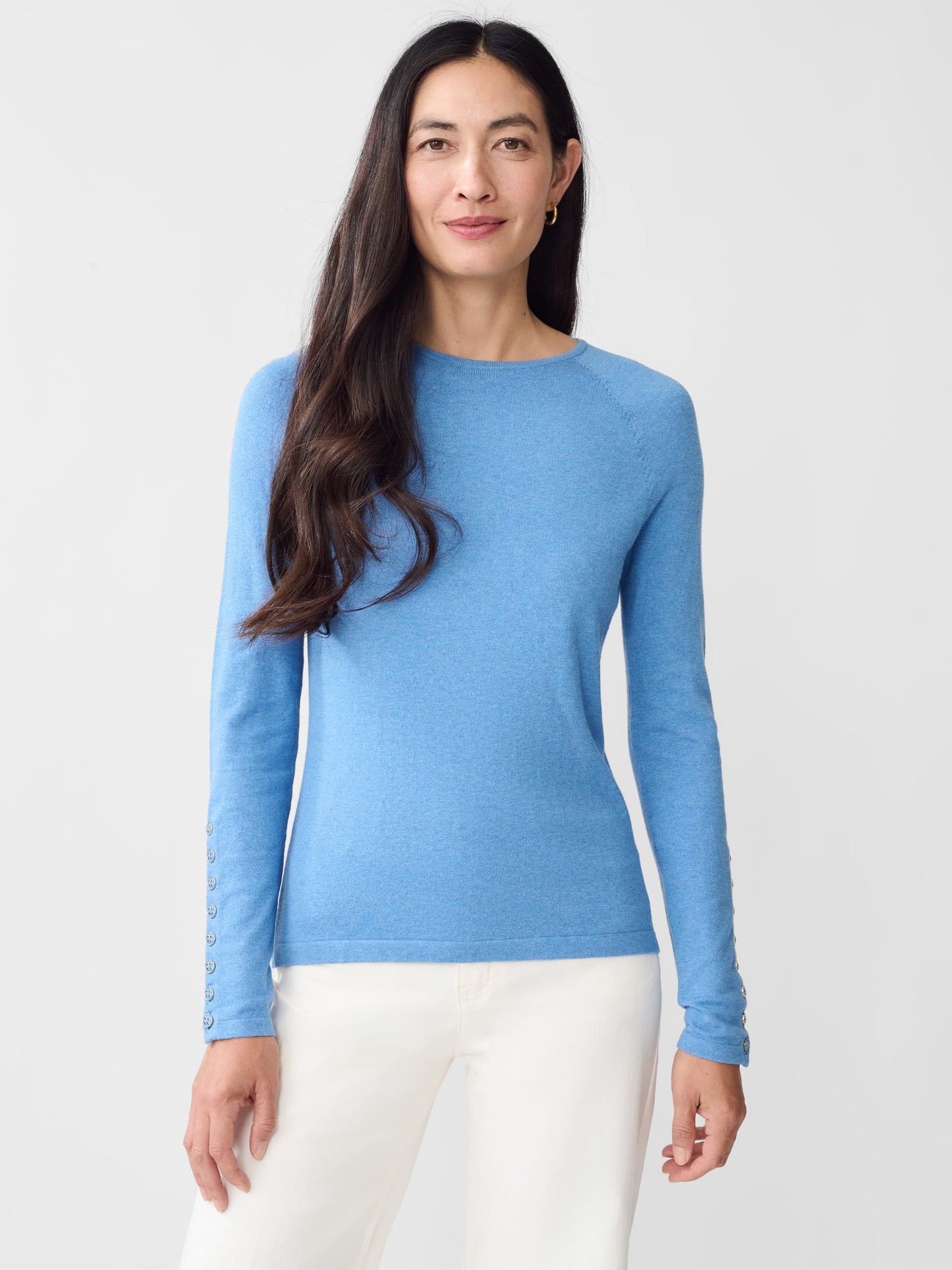 Model wearing J.McLaughlin Jamey sweater in light chambray made with cotton/modal.