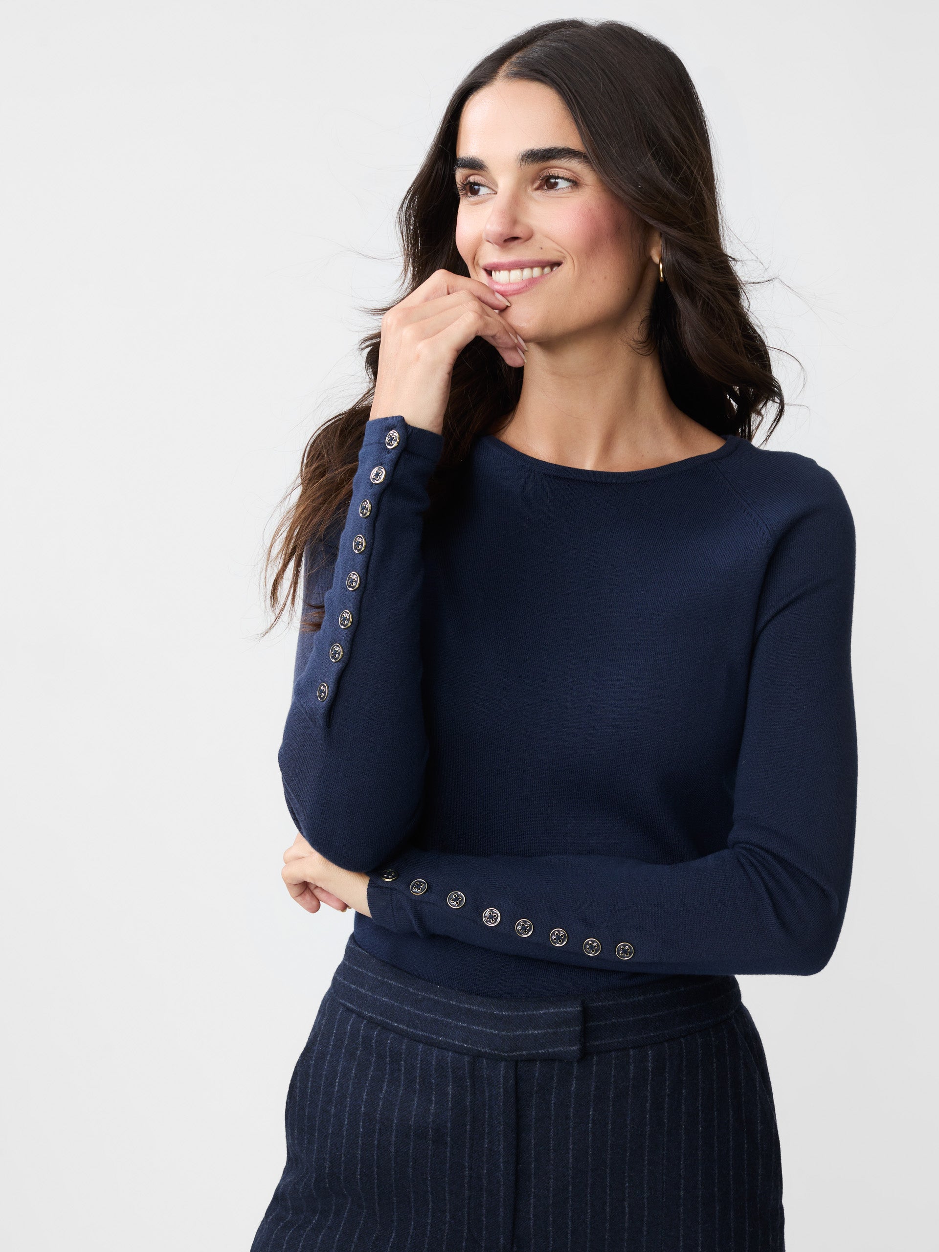 Model wearing J.McLaughlin Jamey sweater in navy made with cotton/modal.