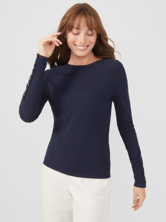 Model wearing J.McLaughlin Jamey sweater in navy made with cotton/modal.