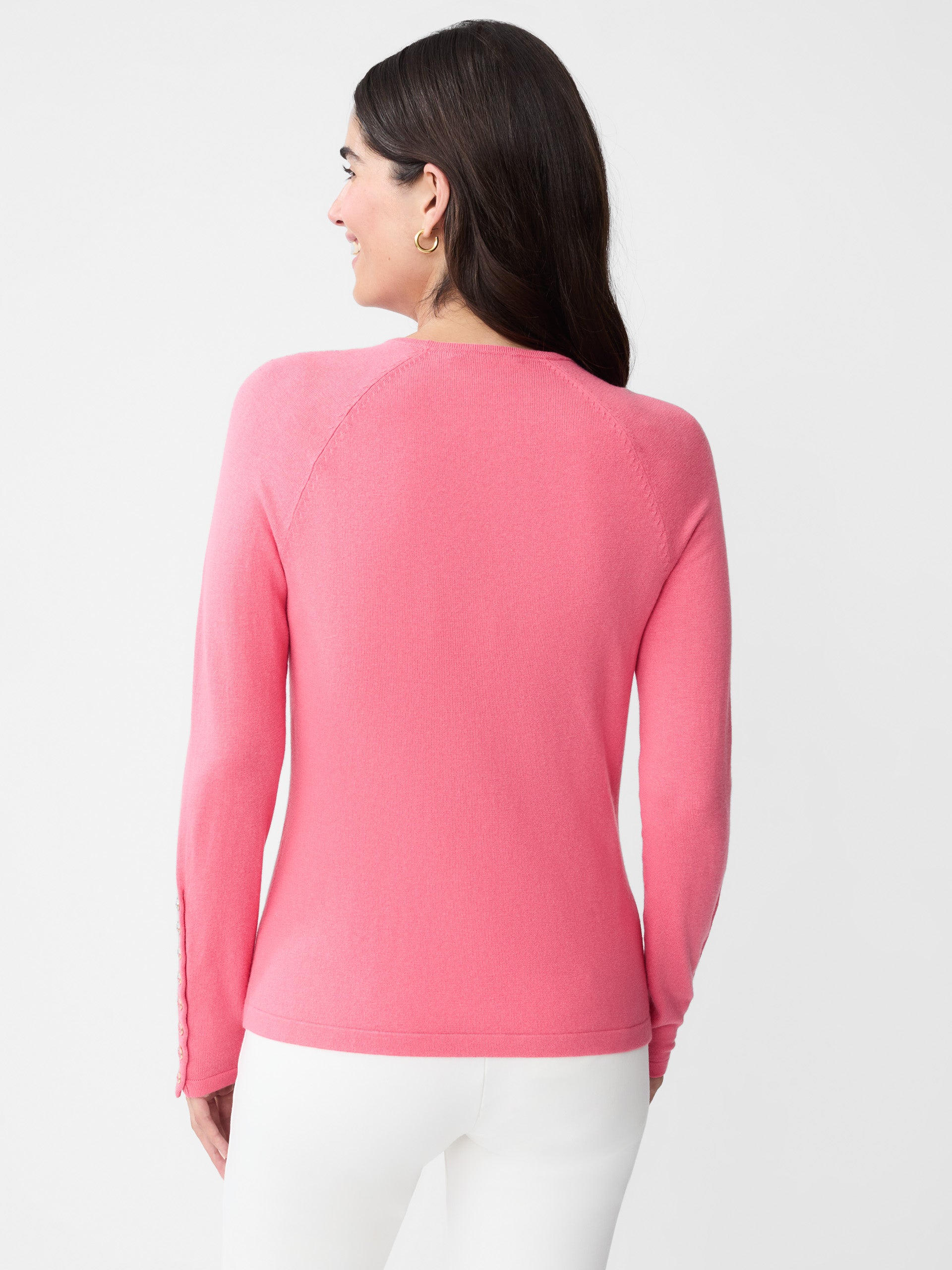 Model wearing J.McLaughlin Jamey sweater in rose pink made with cotton/modal.