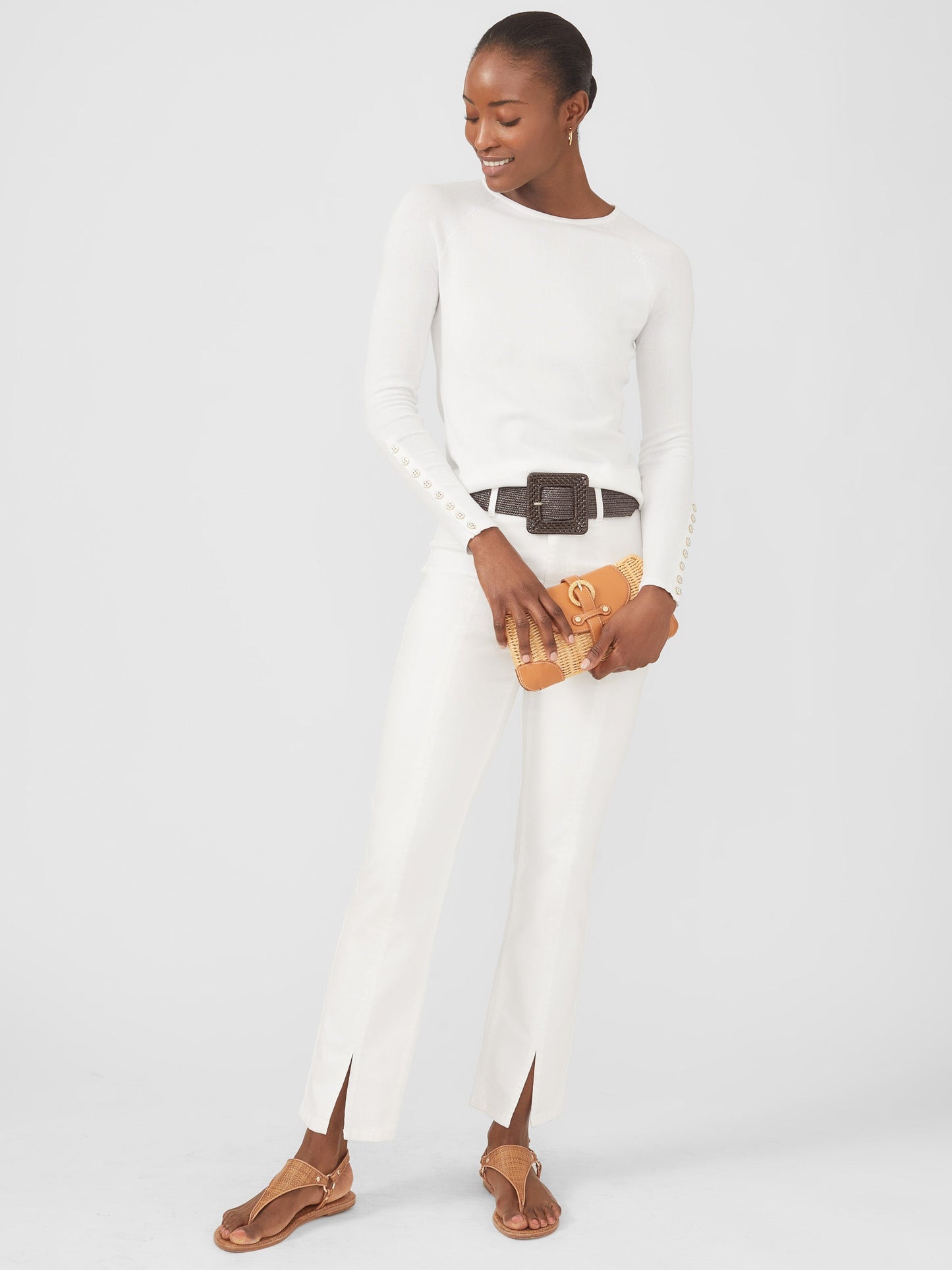 Model wearing J.McLaughlin Jamey sweater in white made with cotton/modal.