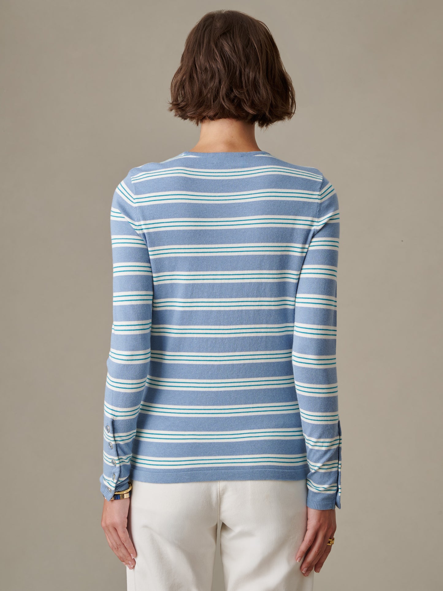 Back view of a person wearing the Jamey Sweater in Stripe by J.McLaughlin, a classic striped sweater showcasing impeccable craftsmanship and an effortlessly stylish design.