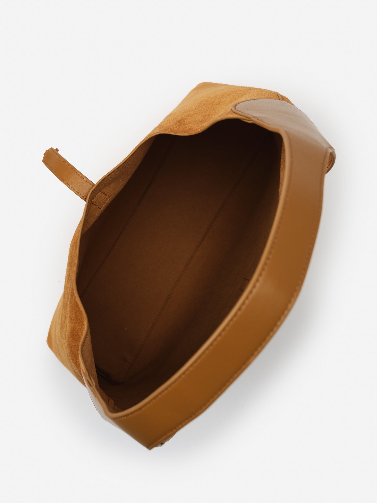 Interior view of the Jenna Suede Tote by J.McLaughlin, showcasing effortlessly stylish suede and leather craftsmanship, embodying enduring designs and a legacy of timeless fashion.