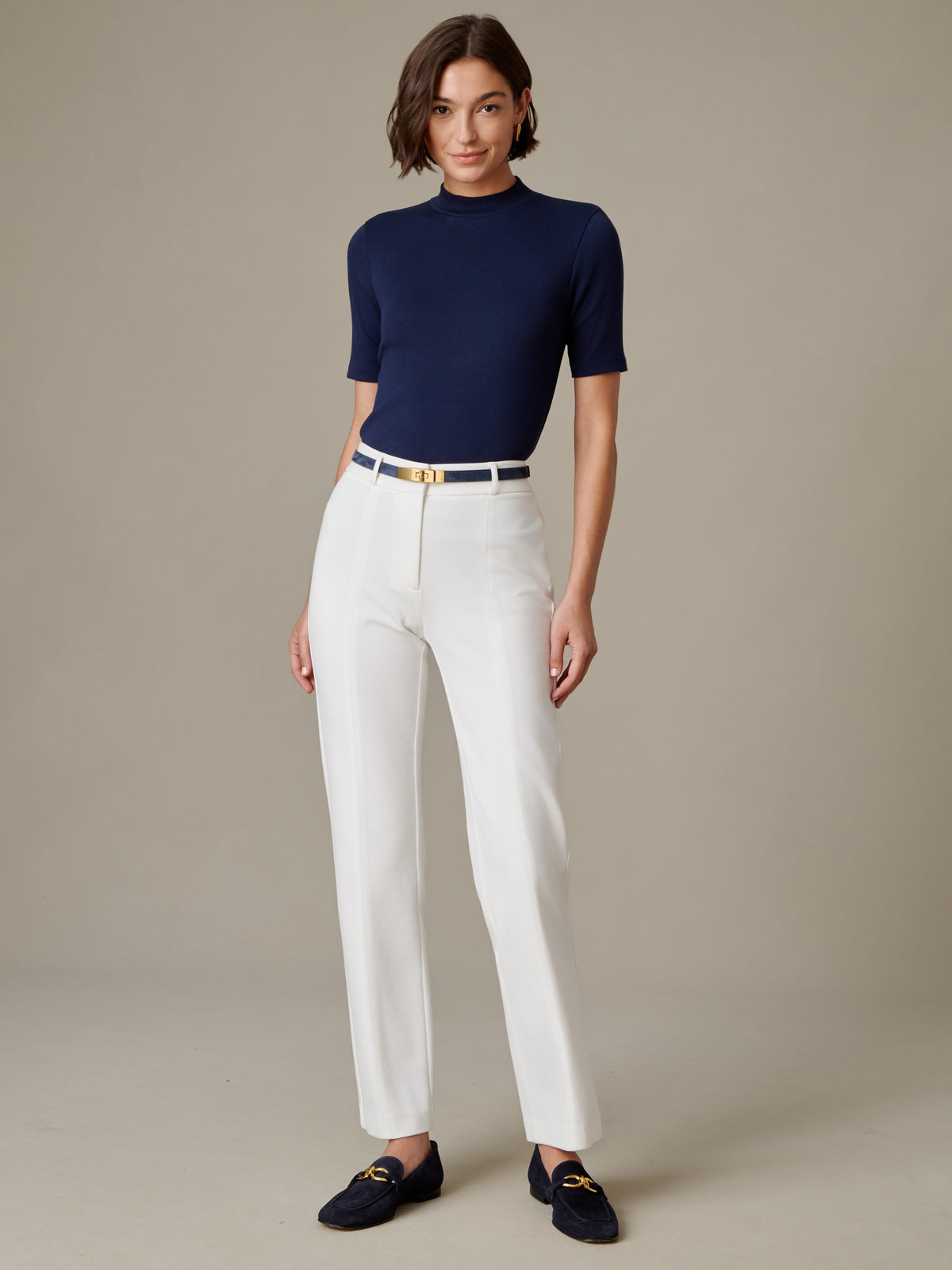 J.McLaughlin Jess Ribbed Top in navy with a mock neckline and ribbed short sleeves styled with white pants and black loafers