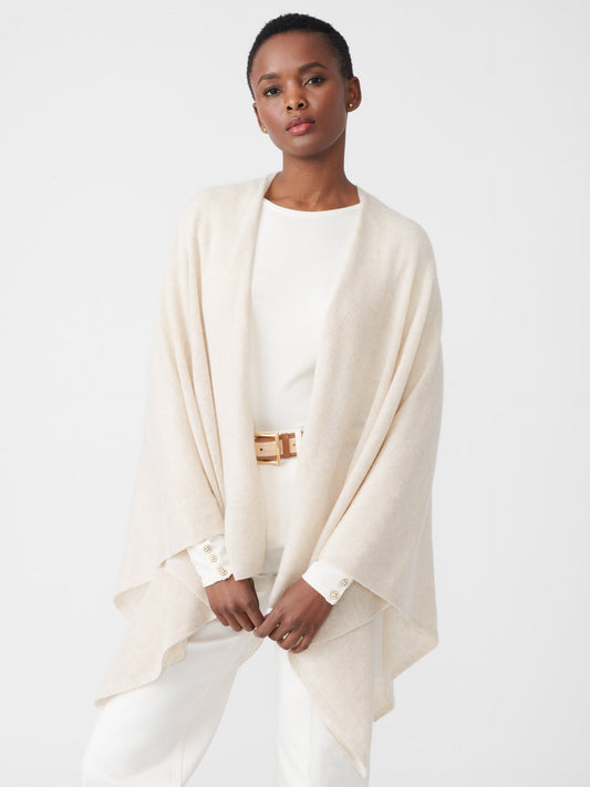 Model wearing J.McLaughlin Julia wrap in oatmeal made with cashmere.