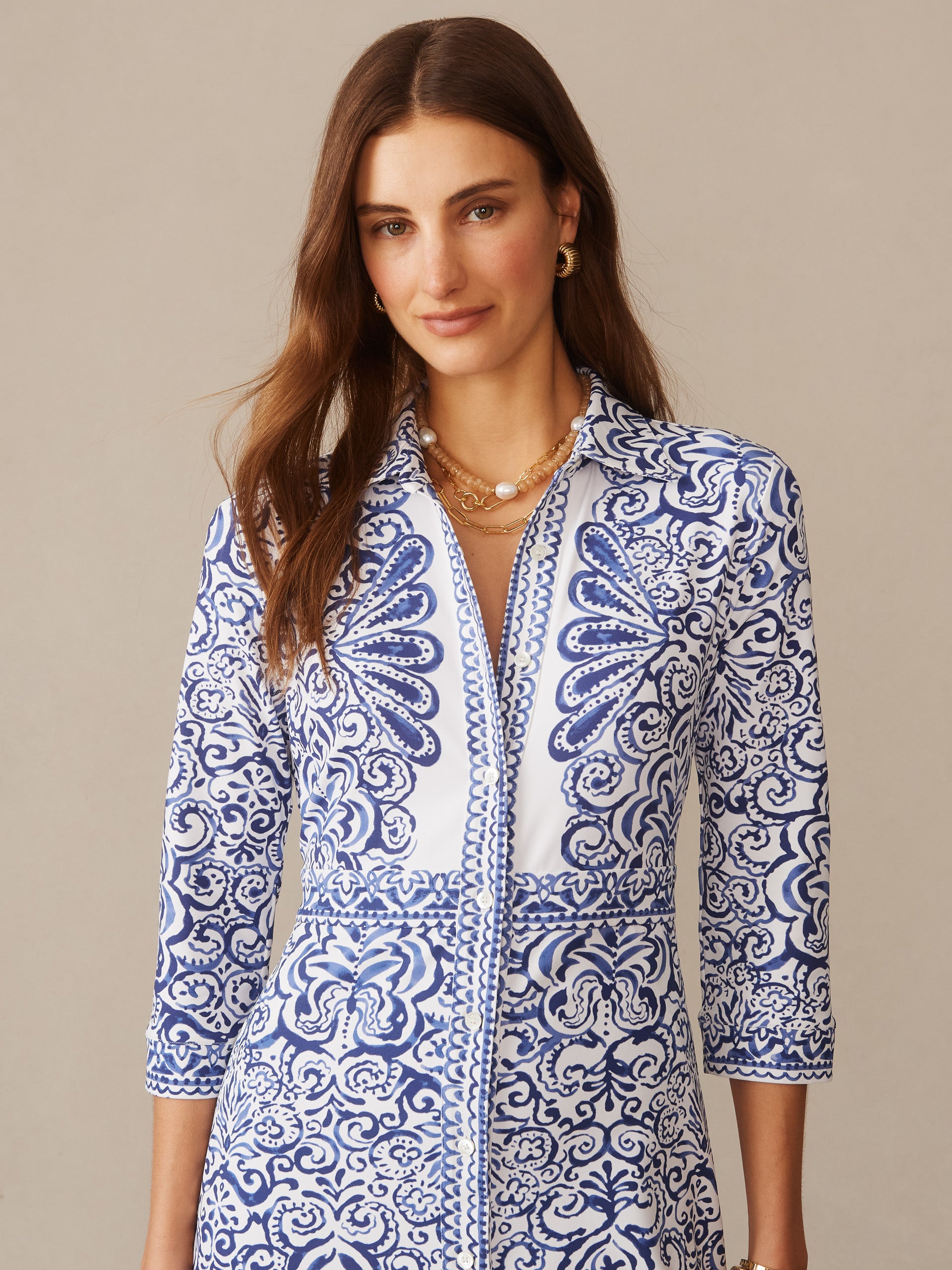 Woman wearing the Kailyn Maxi Dress in Faiz Frame by J.McLaughlin, featuring a blue and white intricate pattern with three-quarter sleeves, showcasing effortlessly stylish and enduring designs.