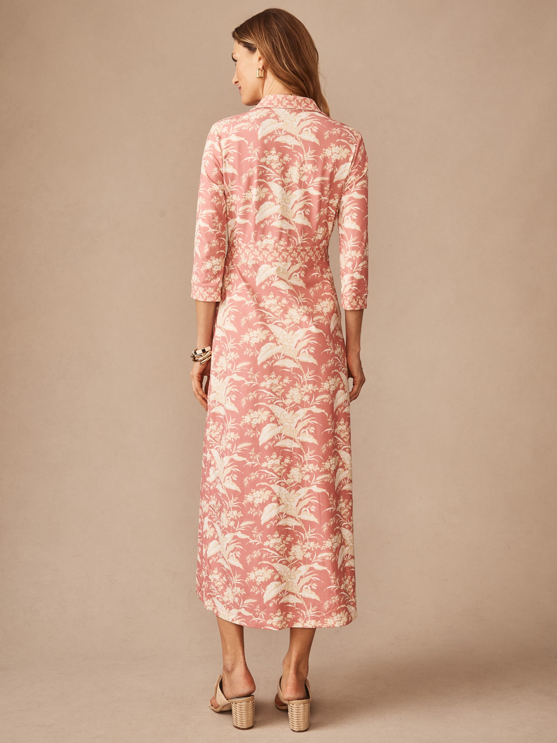 Woman wearing Kailyn Maxi Dress in Giardino Toile Bud by J.McLaughlin, featuring a classic pink and off-white botanical print, designed for enduring style and effortless elegance.