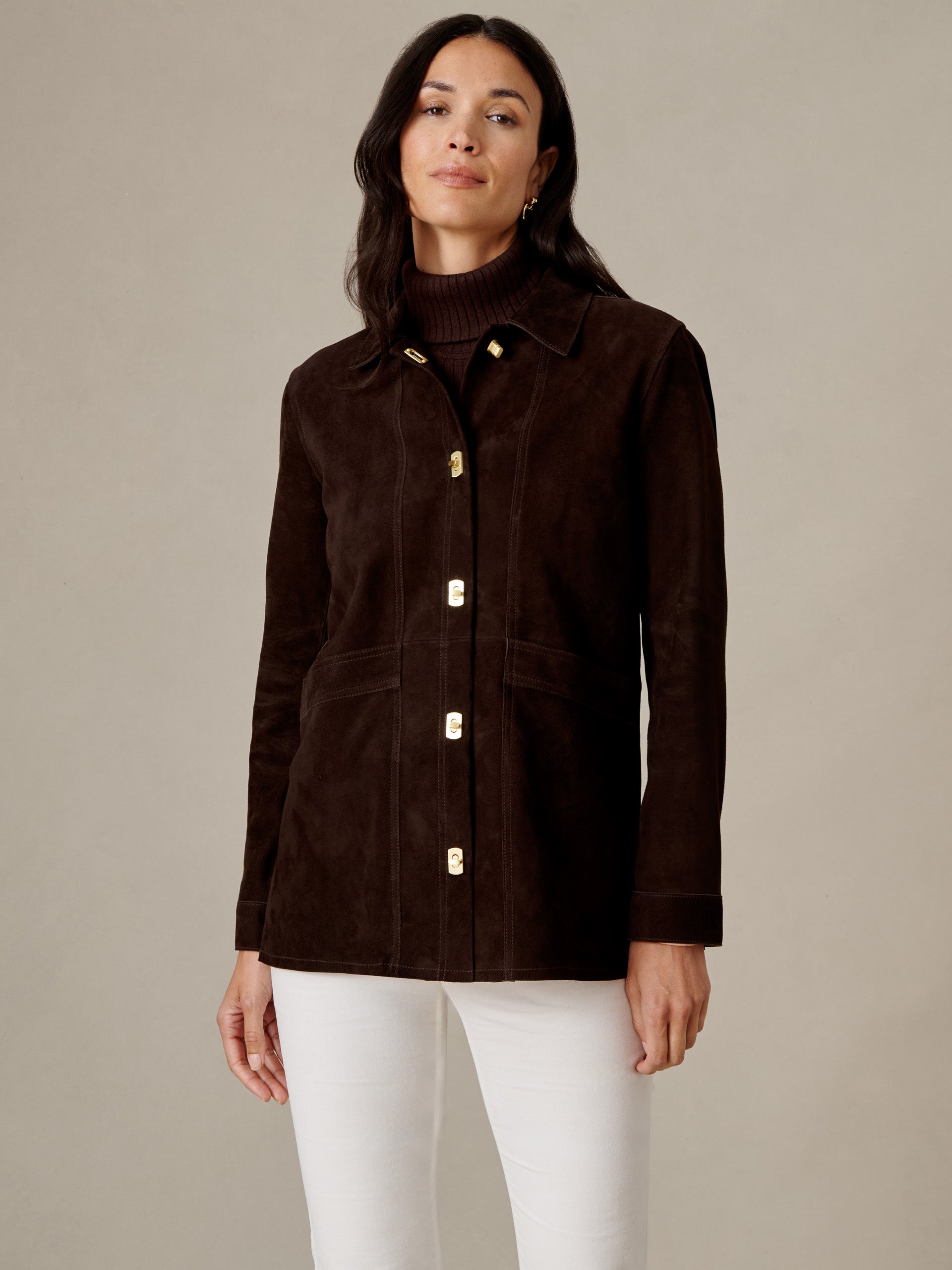 J.McLaughlin Kavya Suede Jacket in dark brown goat suede with button front and patch pockets styled with white pants of timeless appeal