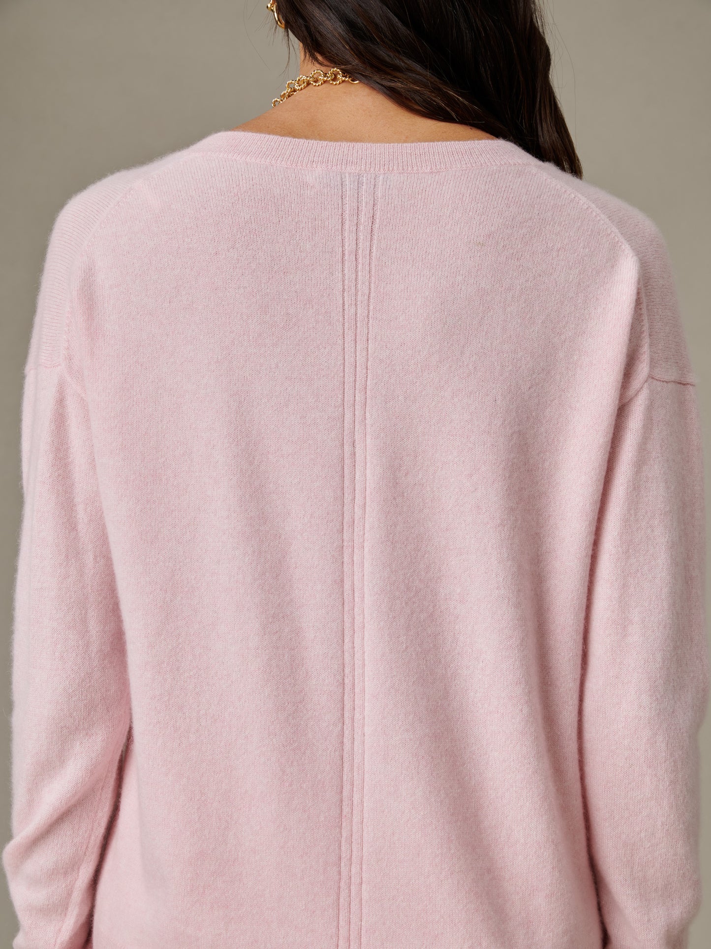 Back view of a soft pink Kerry Cashmere Sweater by J.McLaughlin, showcasing its luxurious texture and classic design, perfect for an effortlessly stylish wardrobe staple.