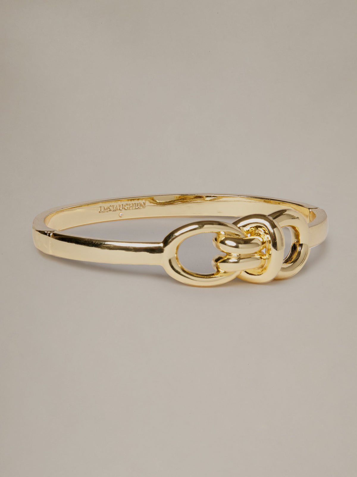 J.McLaughlin Knot Bracelet in polished gold tone with an elegant sculptural knot design for effortlessly stylish everyday wear