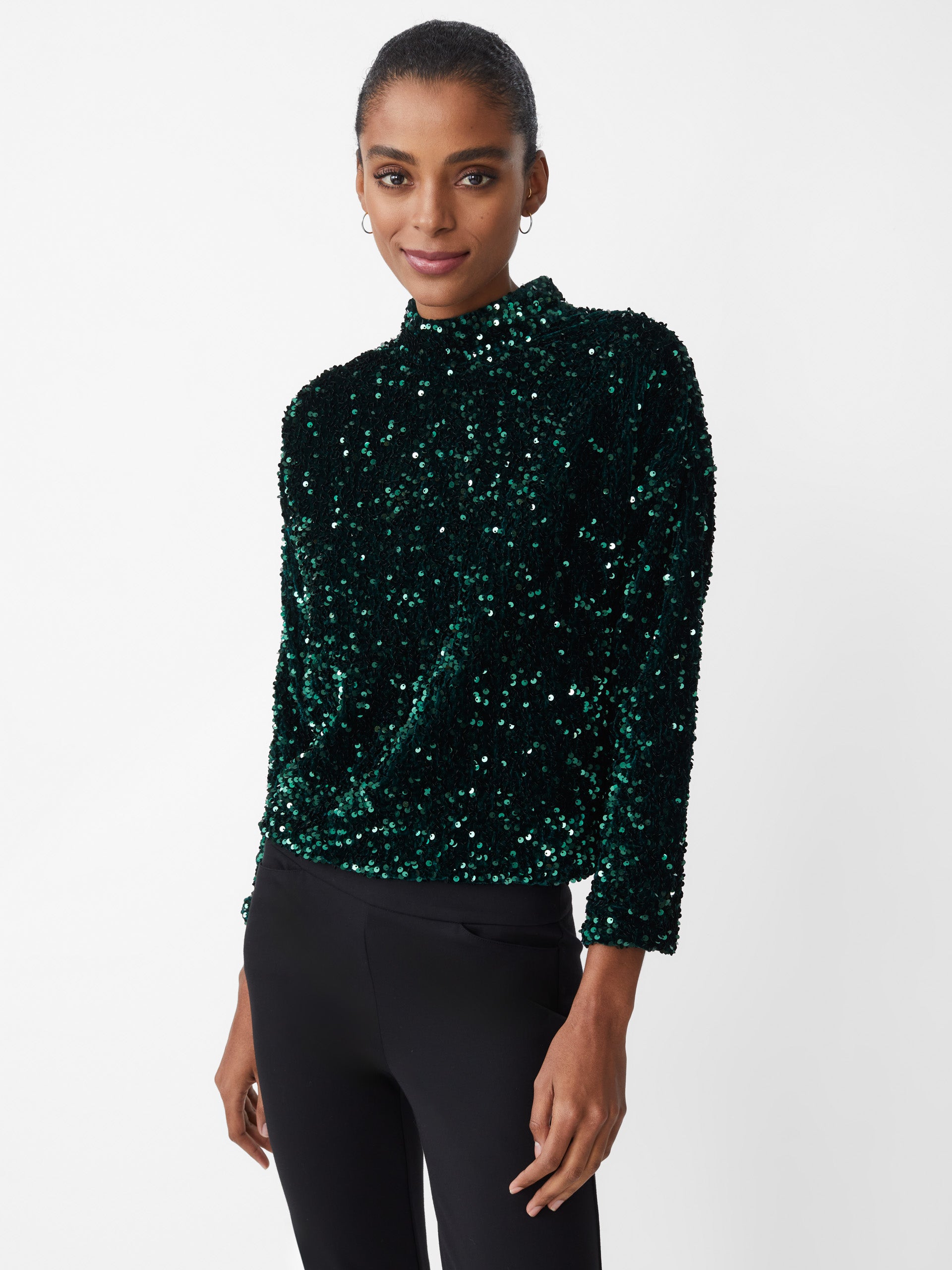 Model wearing J.McLaughlin Leeza top in emerald green made with polyester.