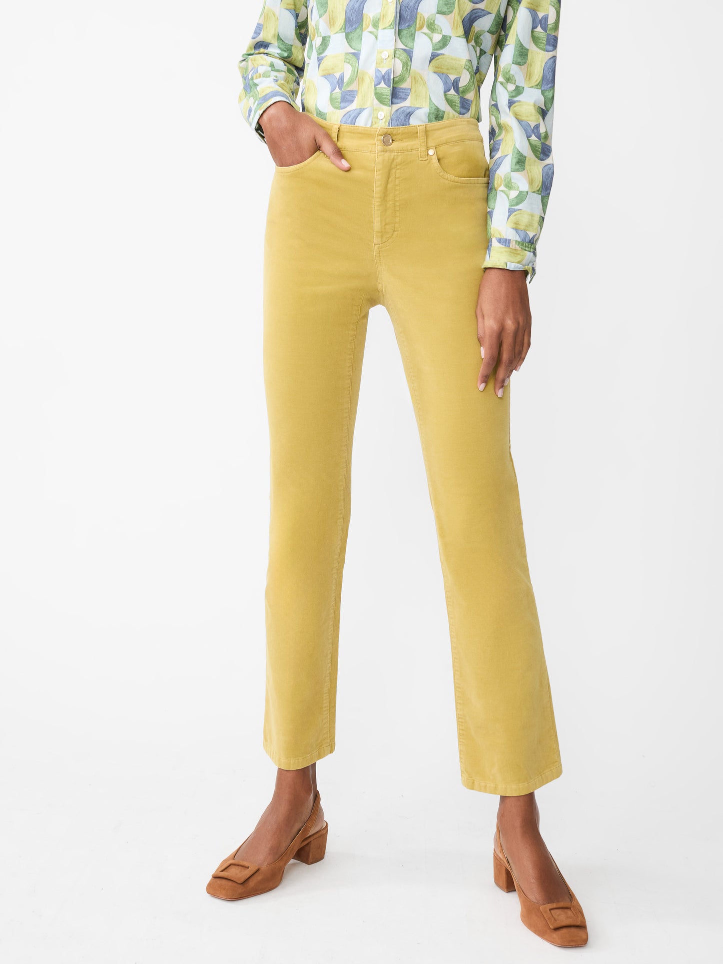 Model wearing J.McLaughlin Lenni jeans in chartreuse made with velveteen.