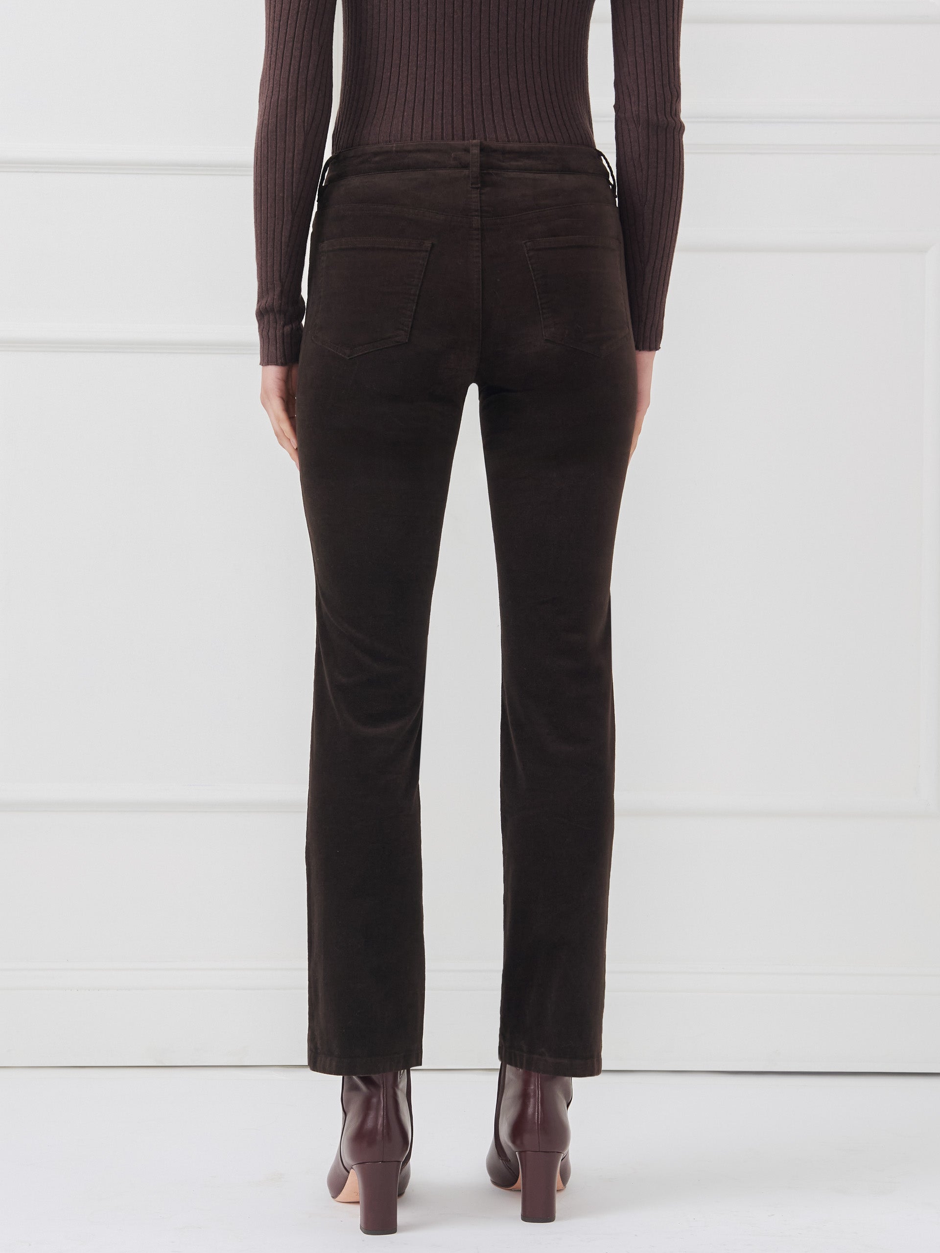 Model wearing J.McLaughlin Lenni pants in dark chocolate made with velveteen.