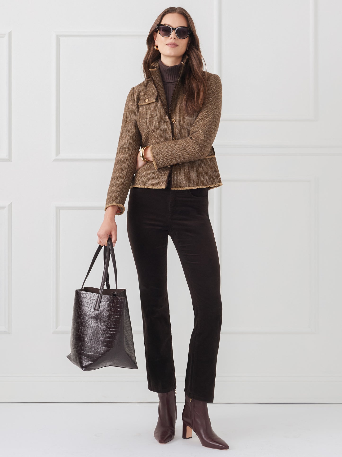 Model wearing J.McLaughlin Lenni pants in dark chocolate made with velveteen.