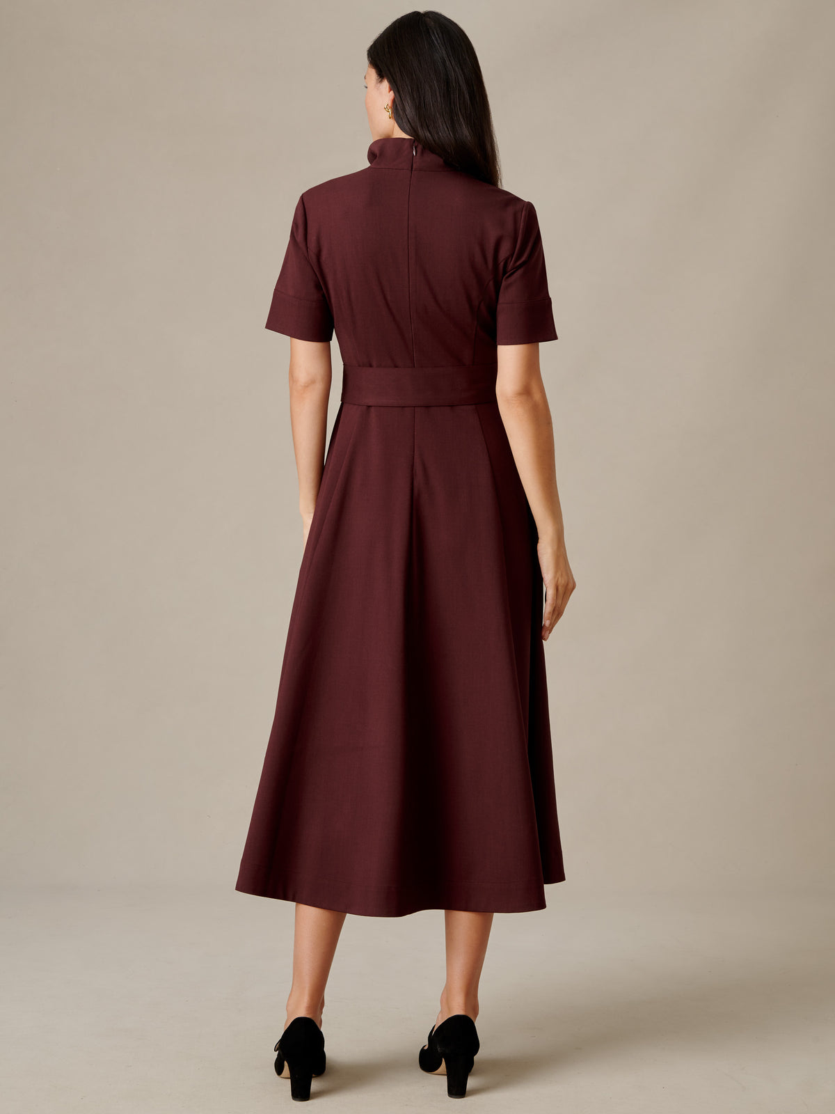 Lily Wool Twill Dress by J.McLaughlin in burgundy with short sleeves and a defined waist shown from the back on a model