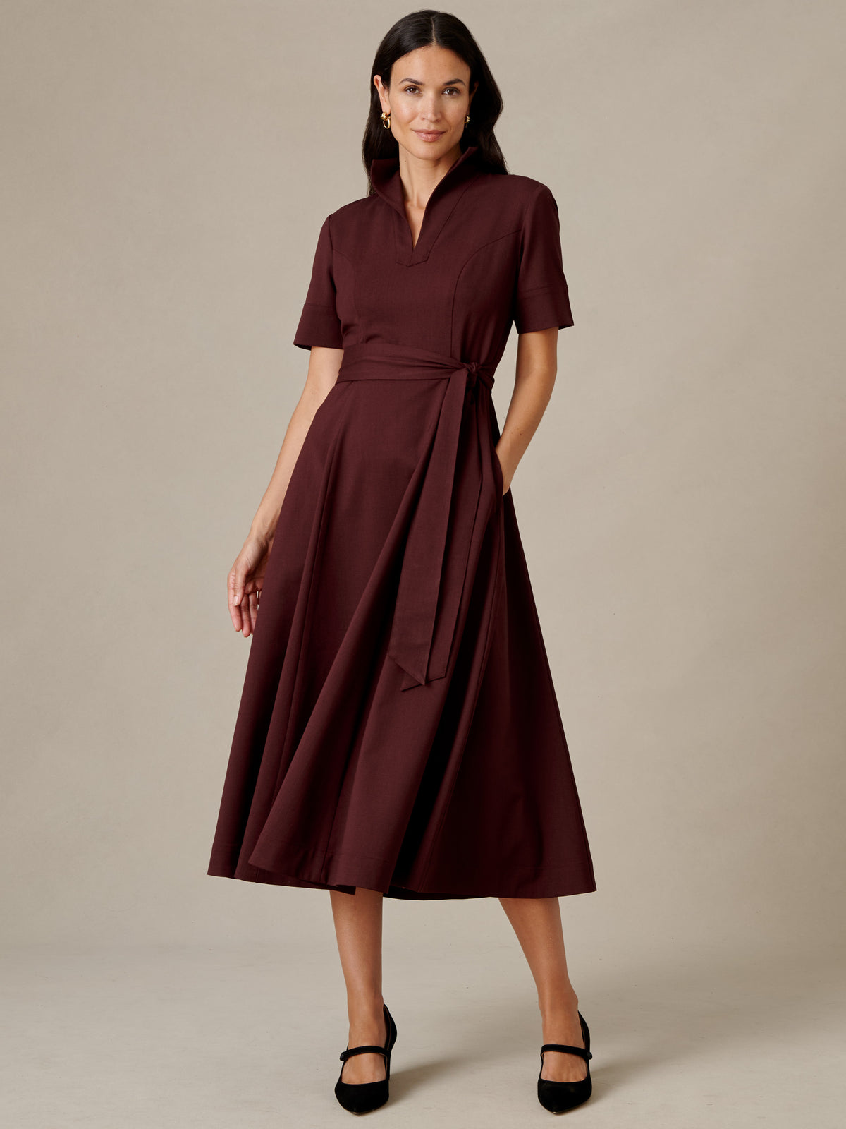 J.McLaughlin Lily Wool Twill Dress in deep burgundy with collared V neckline short sleeves removable waist tie and flowing midi skirt styled with black Mary Jane shoes