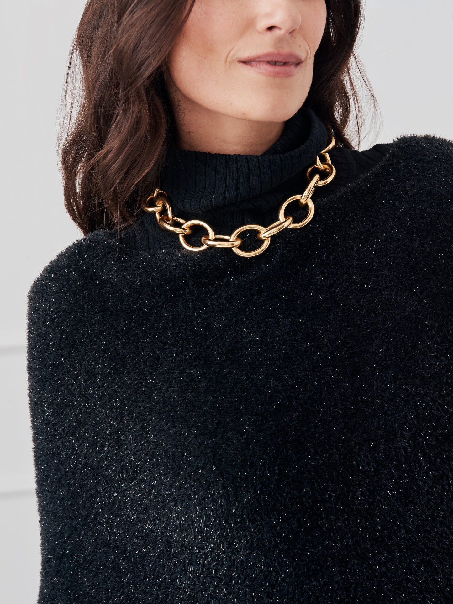 J.McLaughlin Livia poncho in black made with eyelash yarn. 