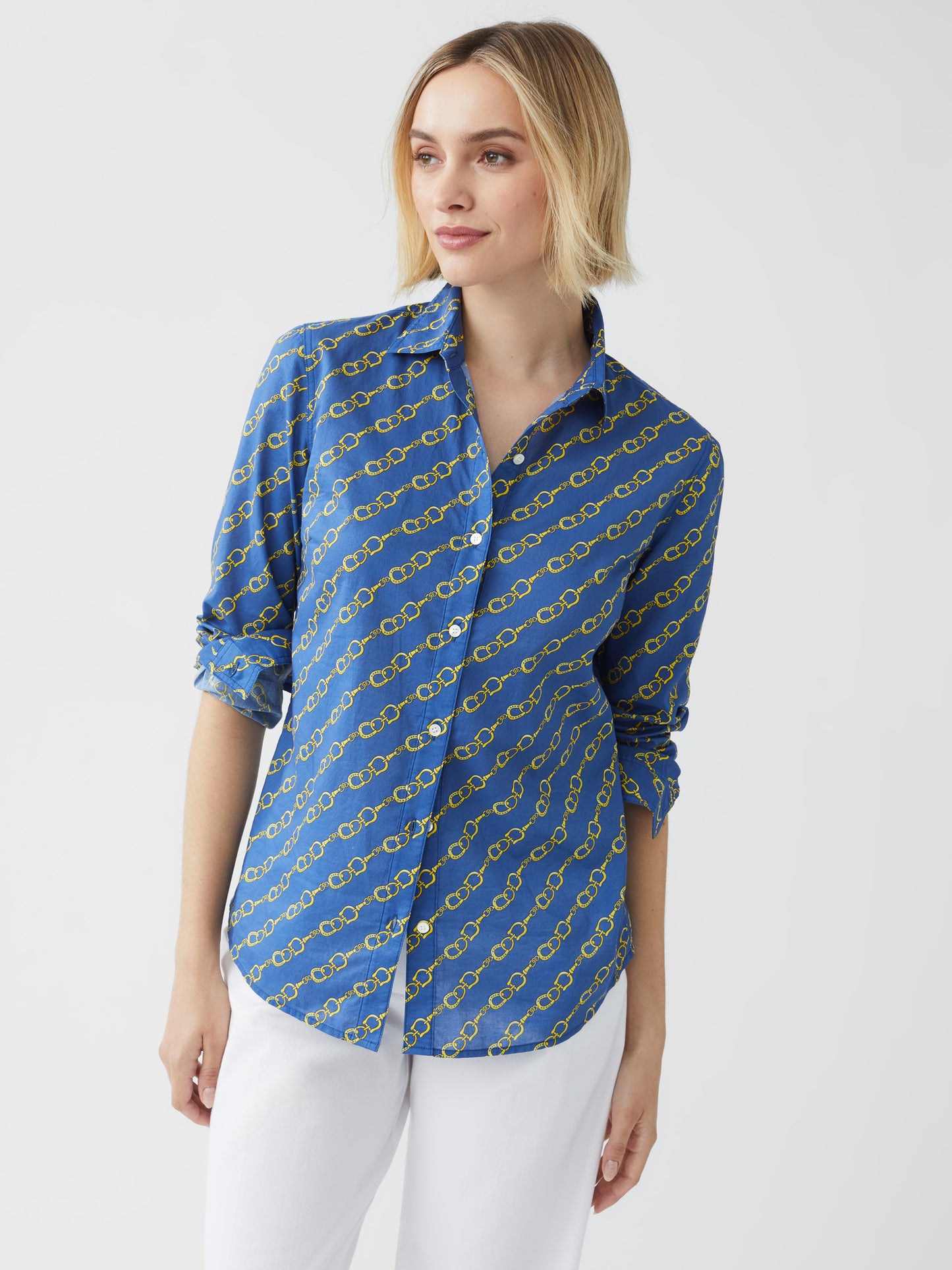 Model wearing J.McLaughlin Lois shirt in medium blue/gold made with cotton.